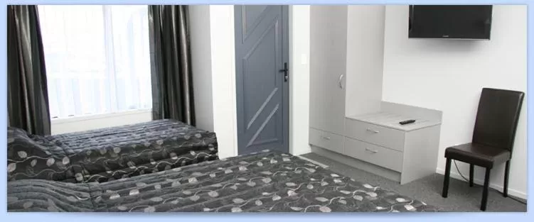 Bed in Eastland Pacific Motel