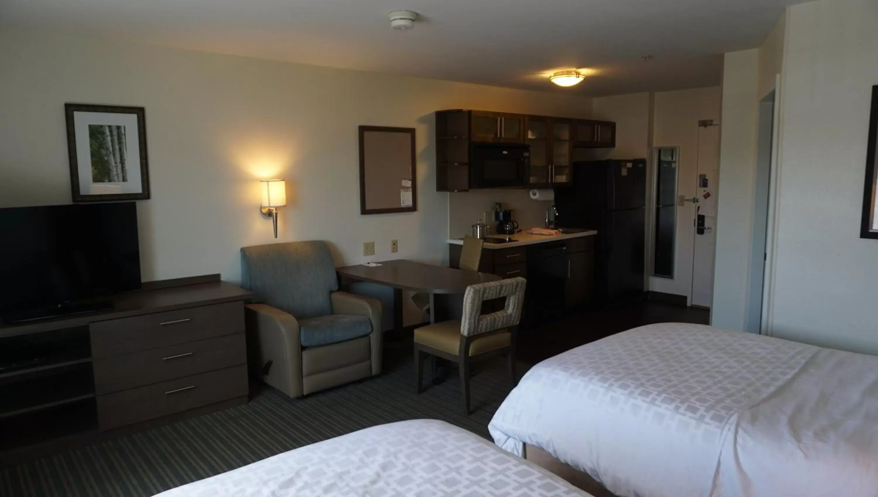 Bedroom, Seating Area in Candlewood Suites-West Springfield, an IHG Hotel