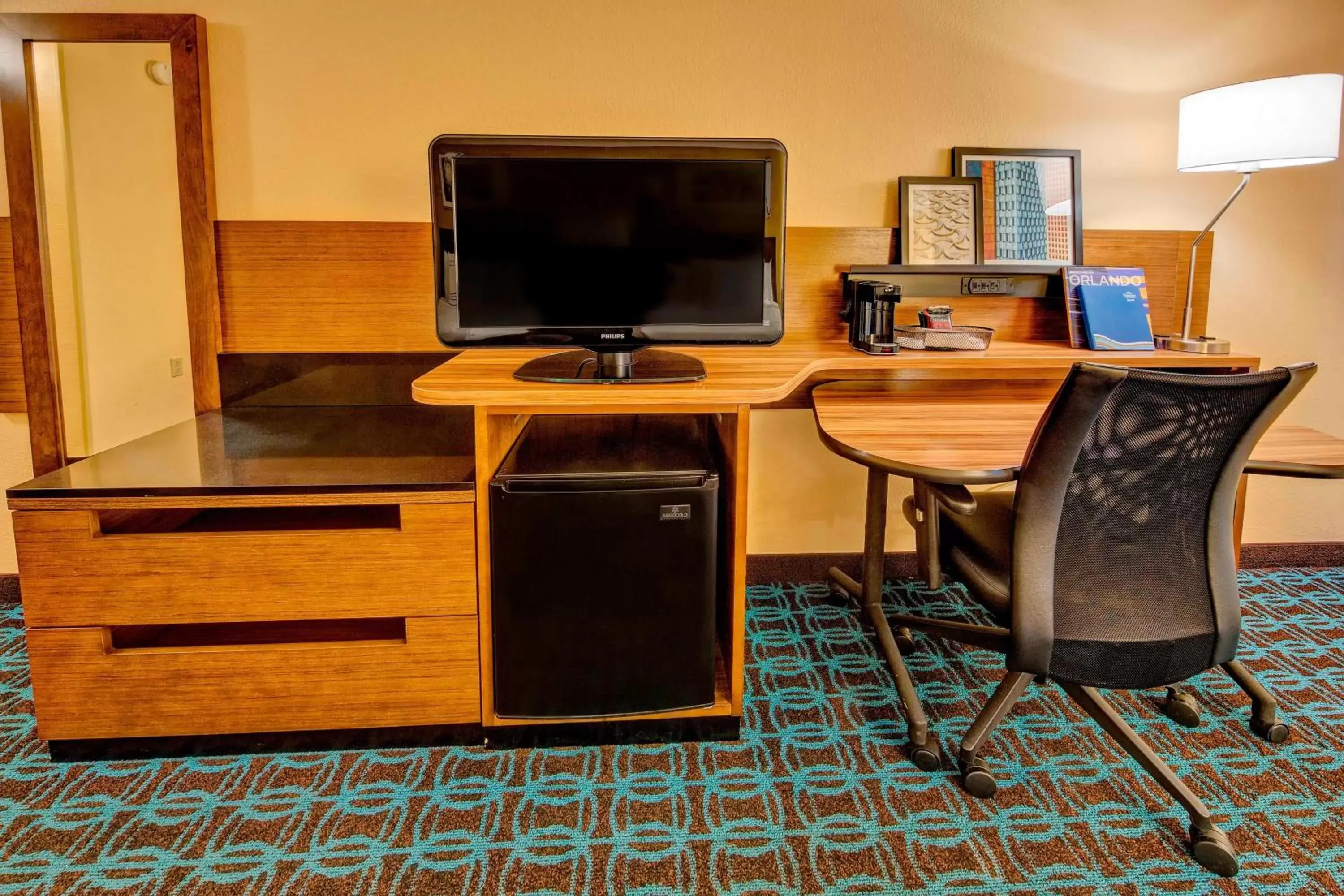 Photo of the whole room, TV/Entertainment Center in Fairfield Inn and Suites by Marriott Orlando Near Universal Orlando