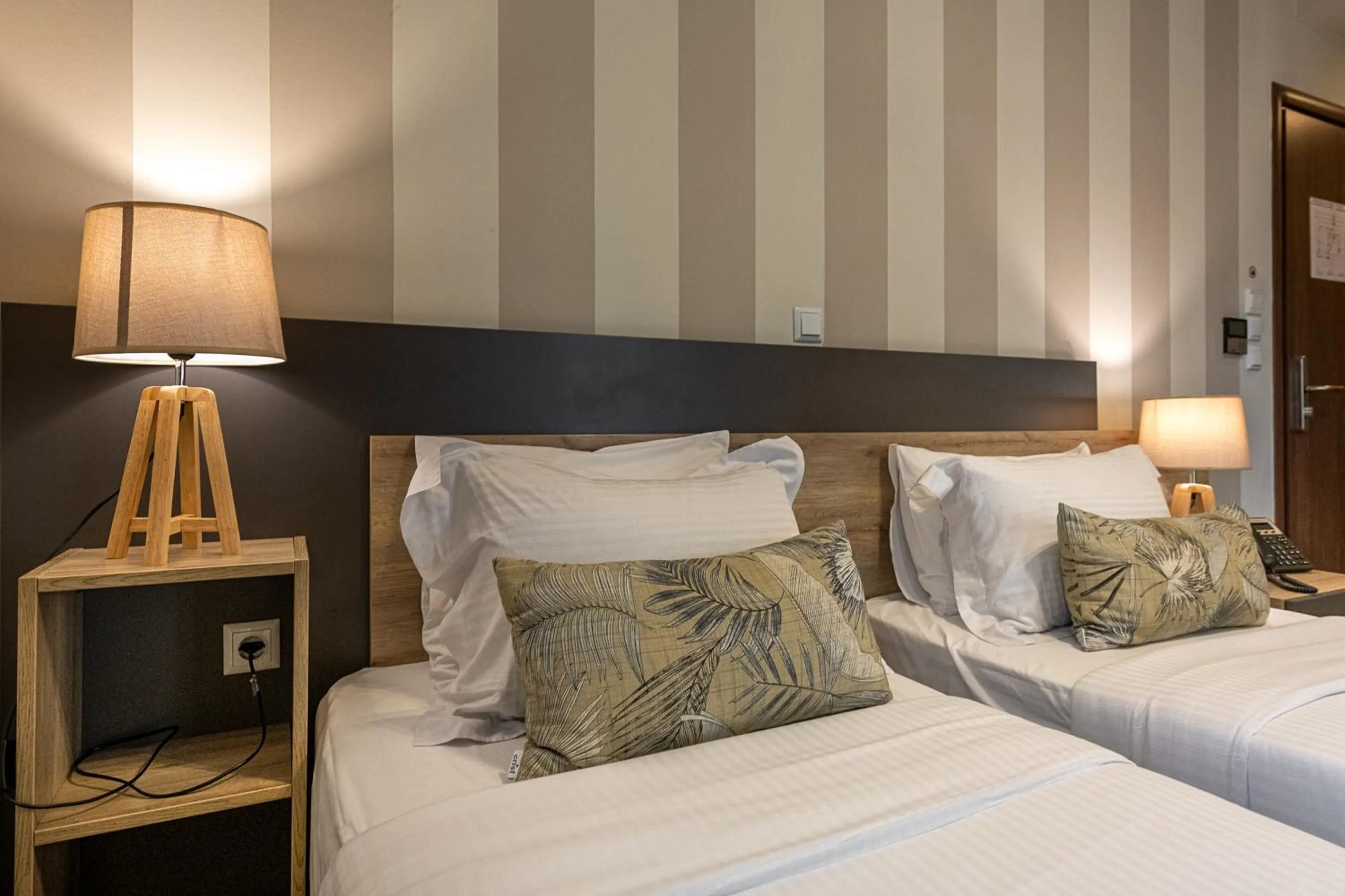 Bed in Hotel @Syngrou Fix