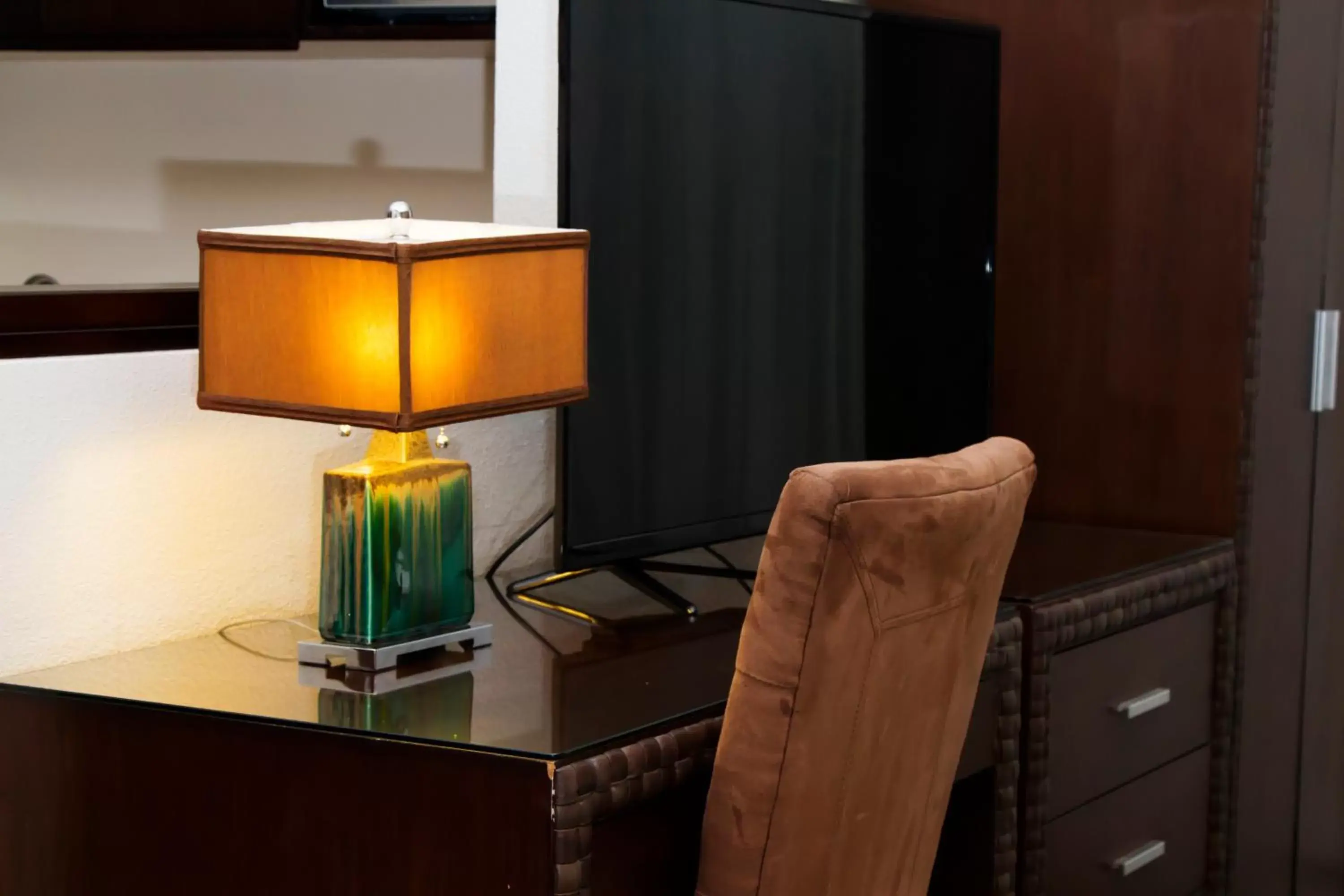 TV and multimedia, TV/Entertainment Center in Rincon del Valle Hotel & Suites