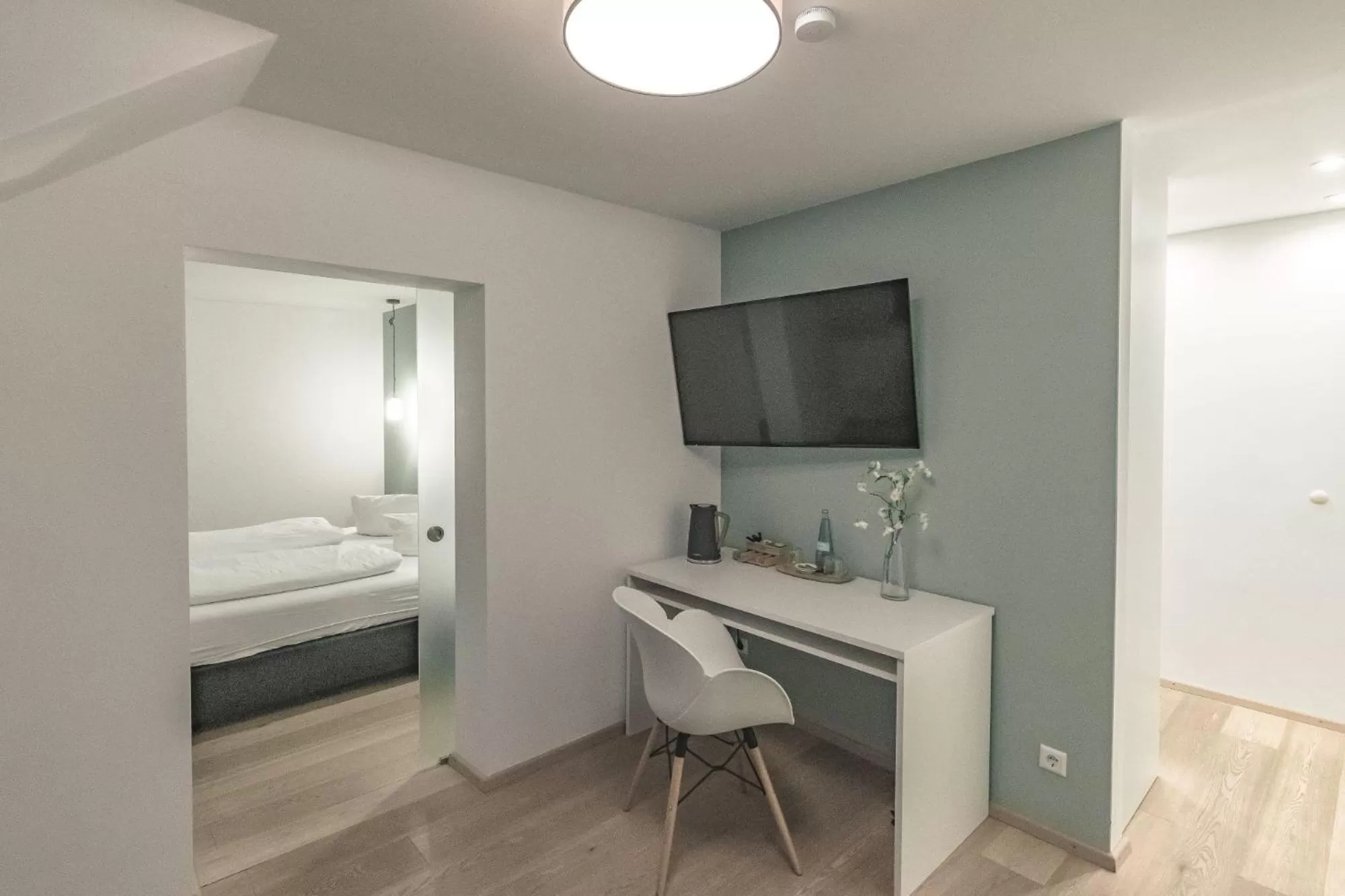 Bed, TV/Entertainment Center in Wohlfühlhotel Landmann