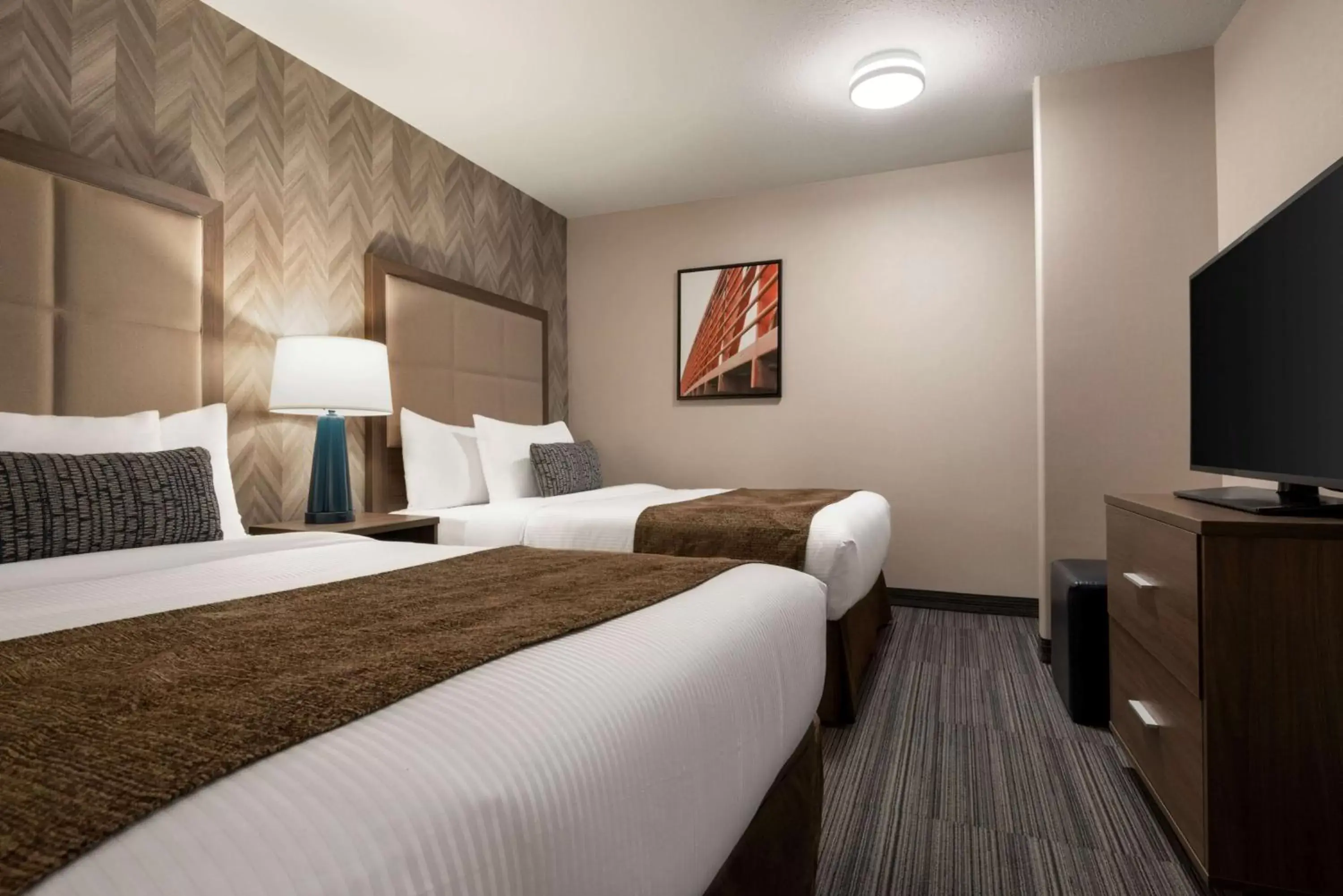 Photo of the whole room, Bed in Ramada by Wyndham Airdrie Hotel & Suites