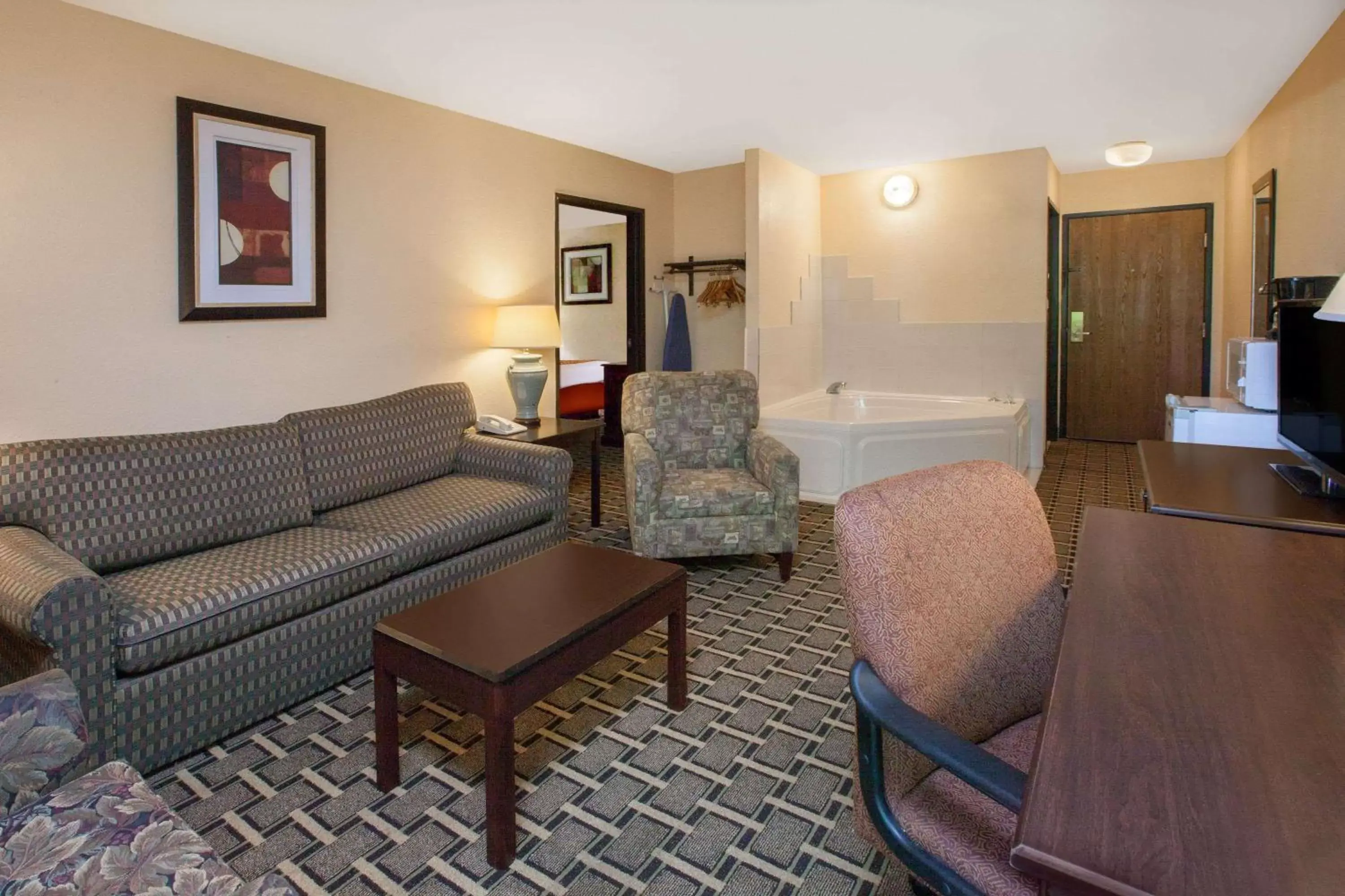 Photo of the whole room, Seating Area in Days Inn & Suites by Wyndham Madison Heights MI