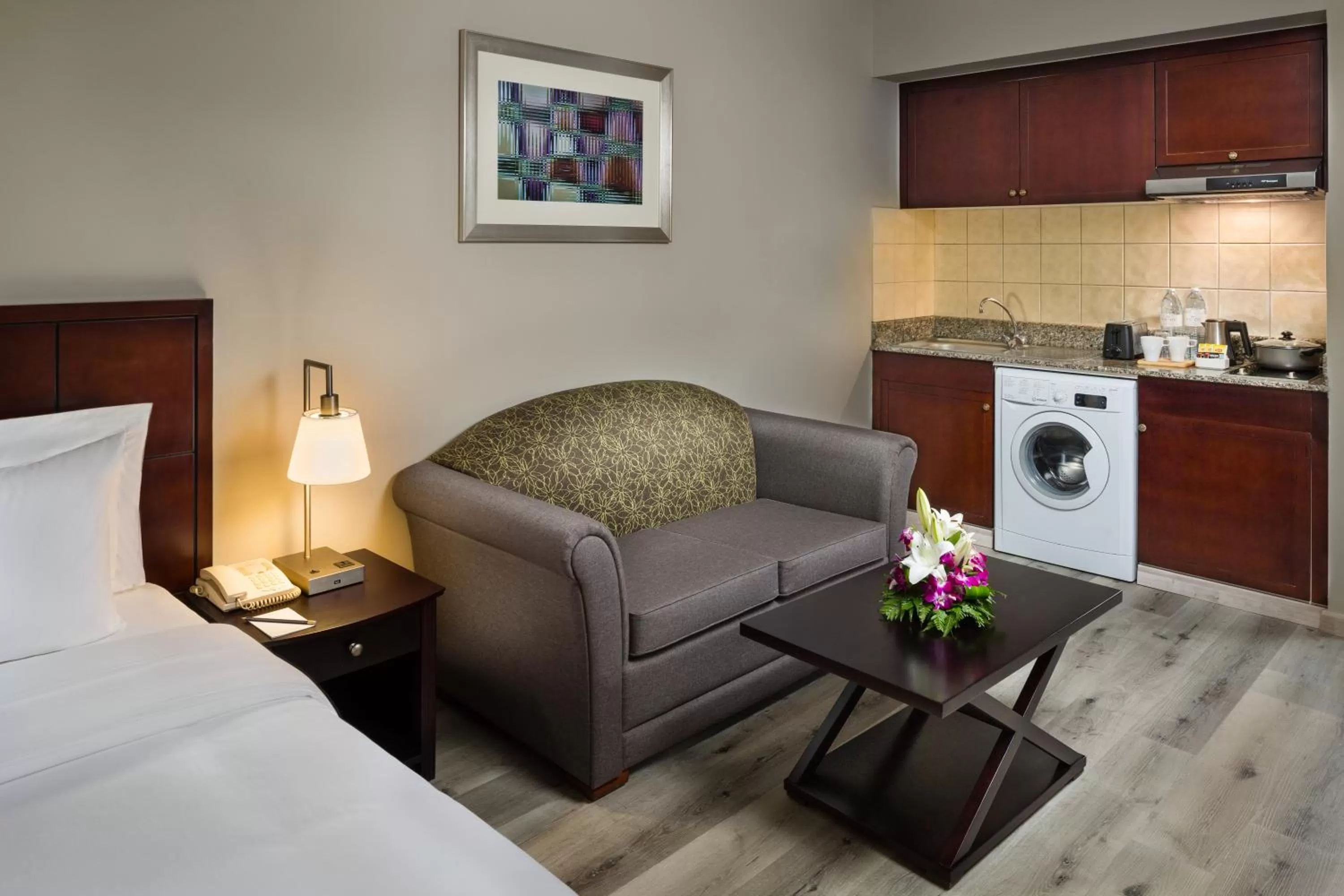 Kitchen or kitchenette, Bed in Savoy Crest Hotel Apartments