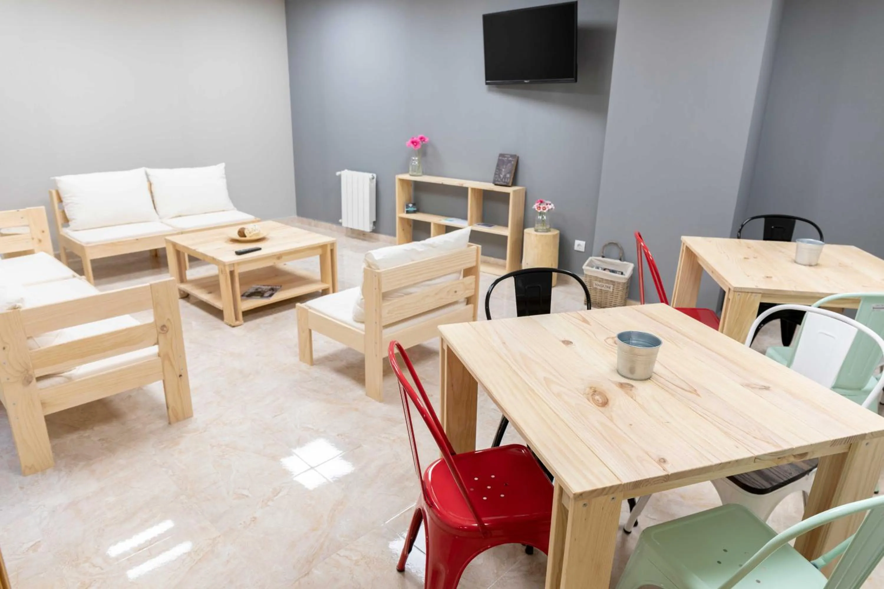 Communal lounge/ TV room in Alda Estella Hostel