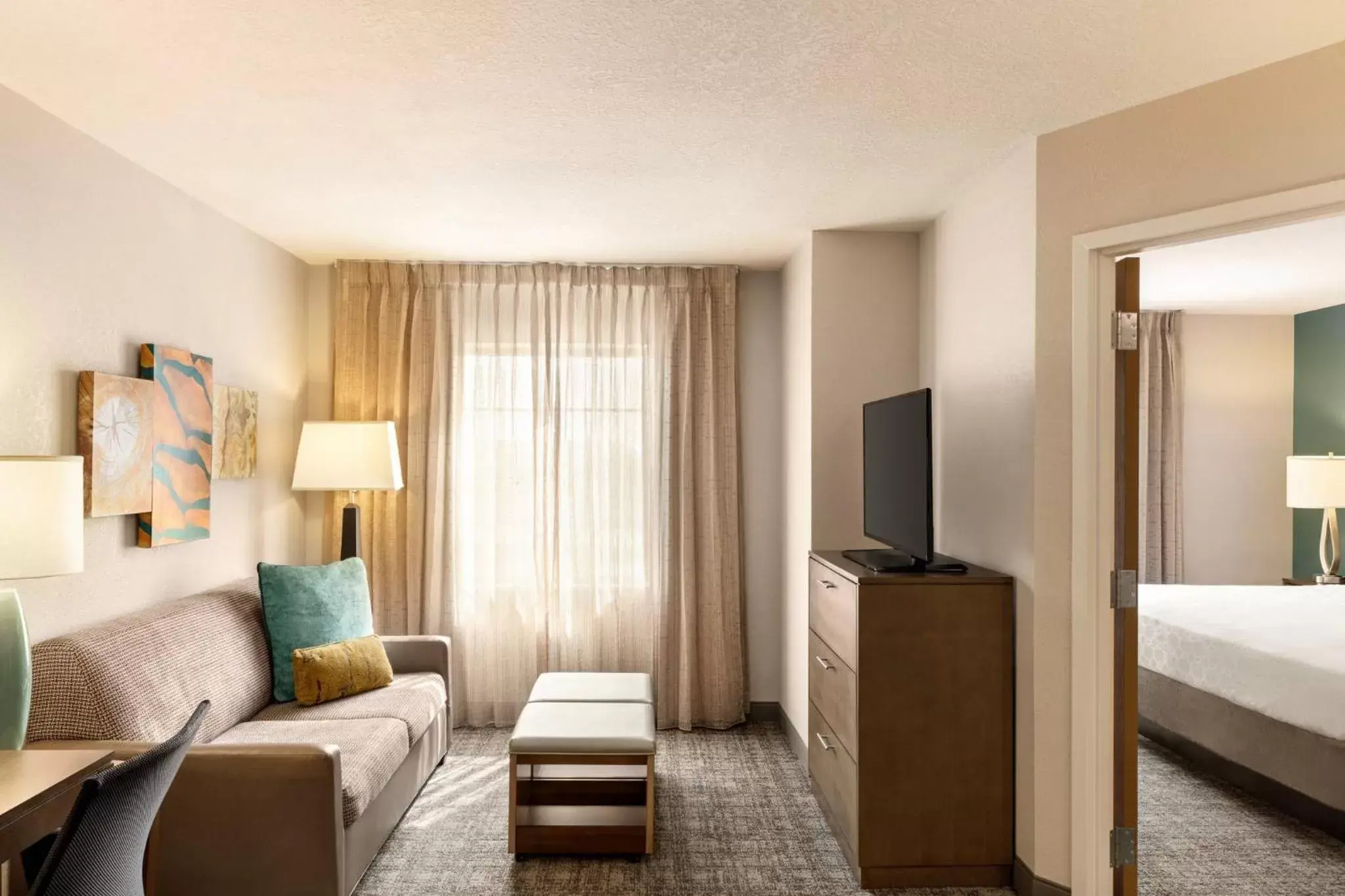 Bedroom, Seating Area in Staybridge Suites Fort Wayne, an IHG Hotel