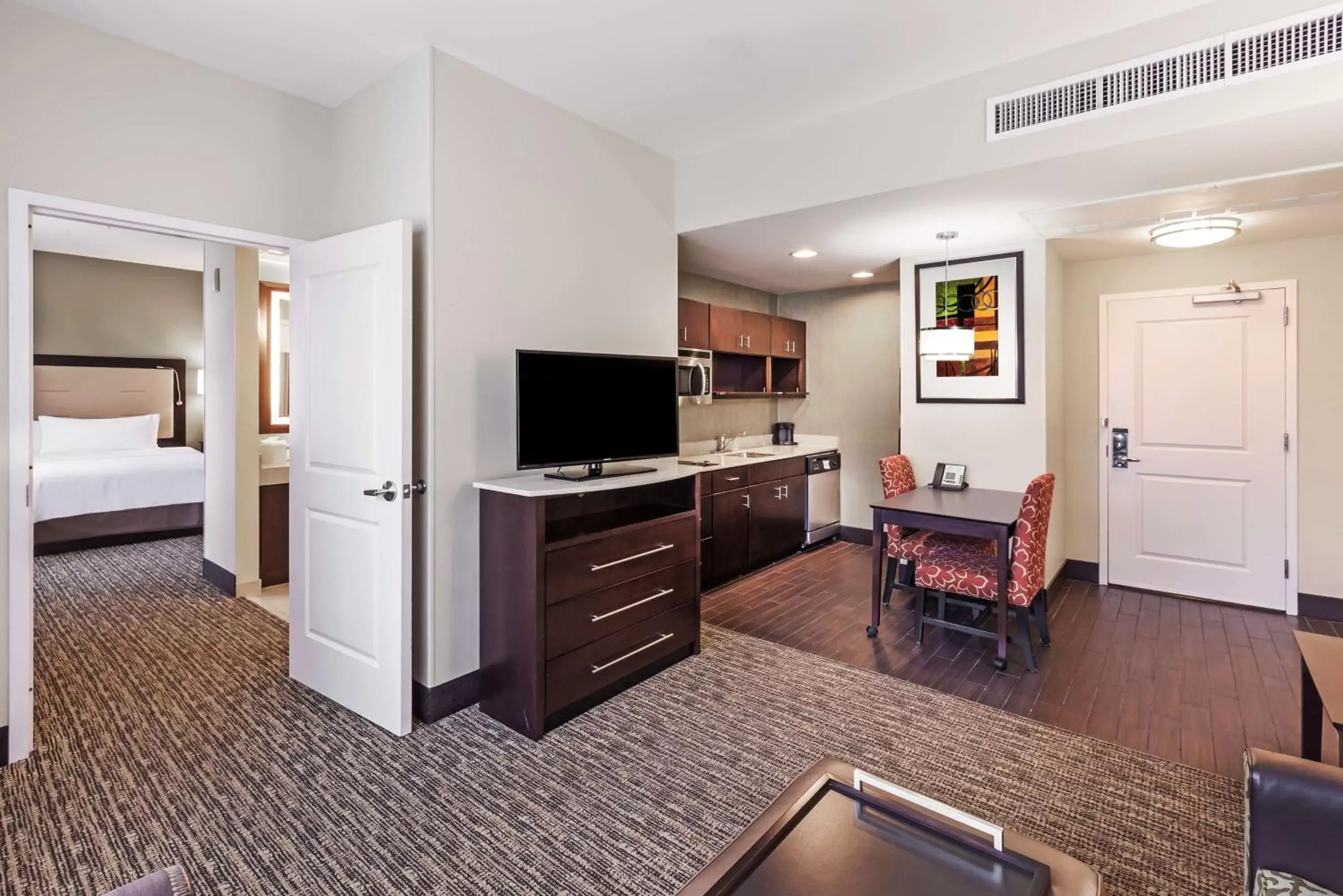 Bedroom, TV/Entertainment Center in Homewood Suites Dallas Downtown
