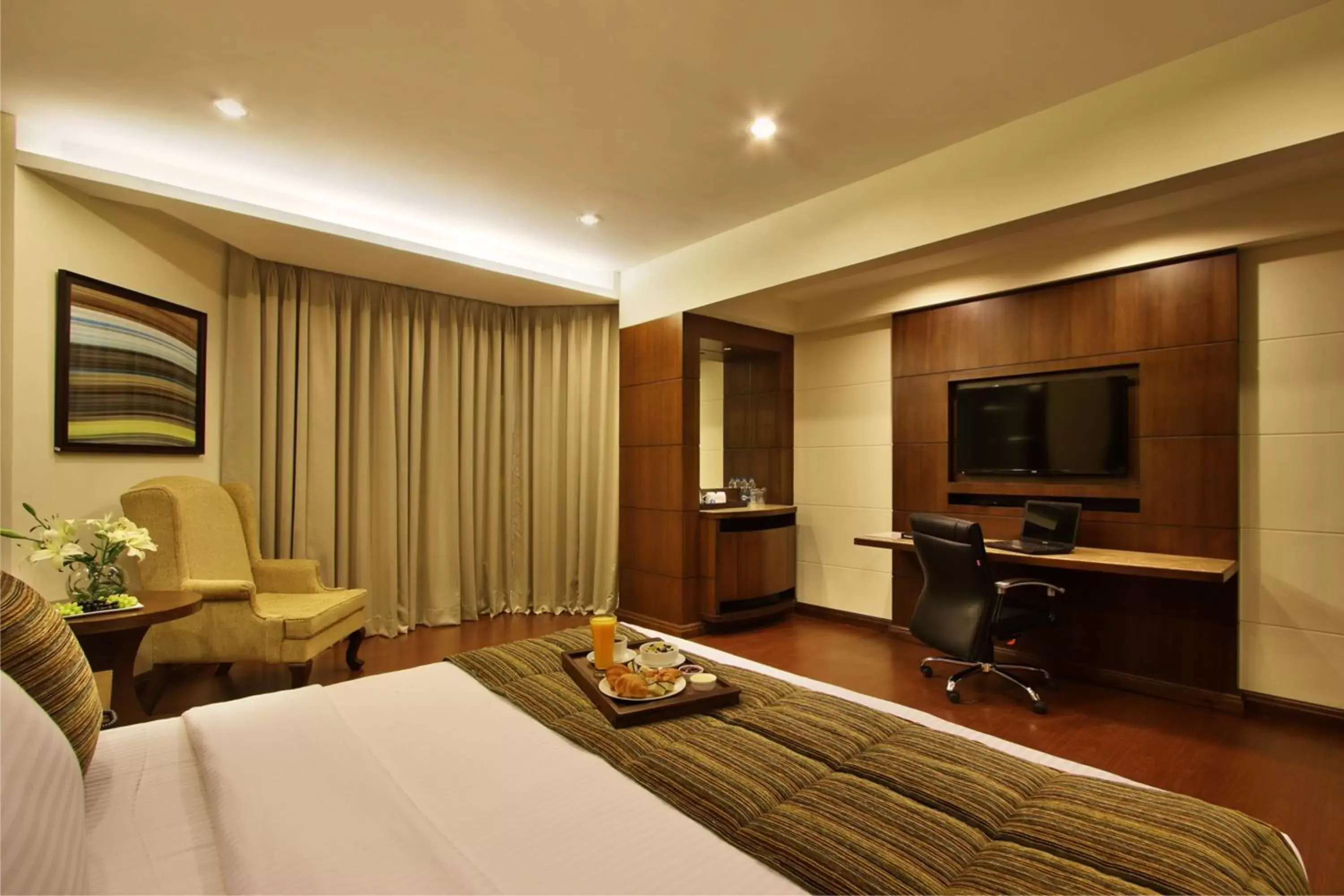 Photo of the whole room, TV/Entertainment Center in Hotel Express Residency Vadodara