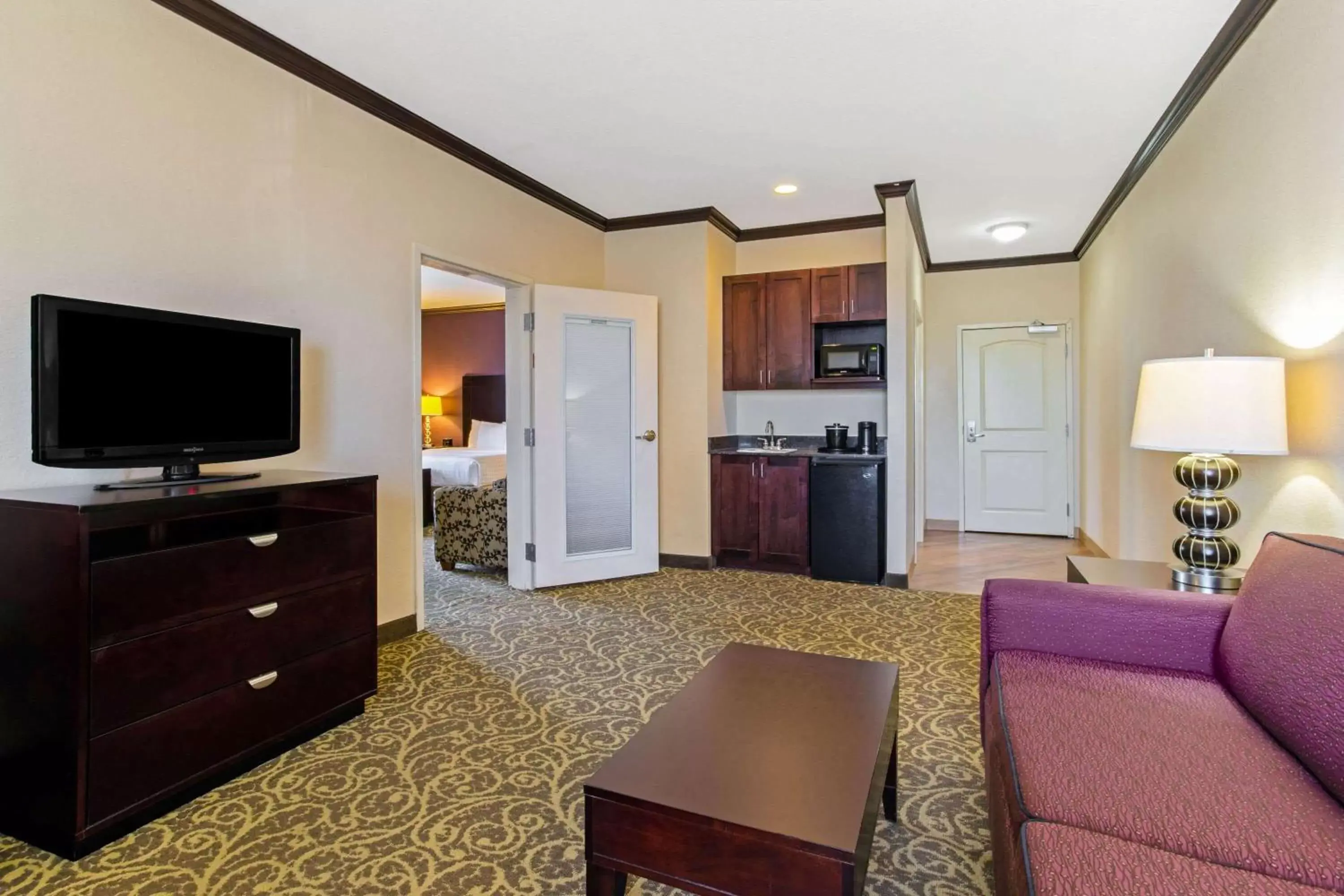 Photo of the whole room, TV/Entertainment Center in La Quinta by Wyndham Burleson