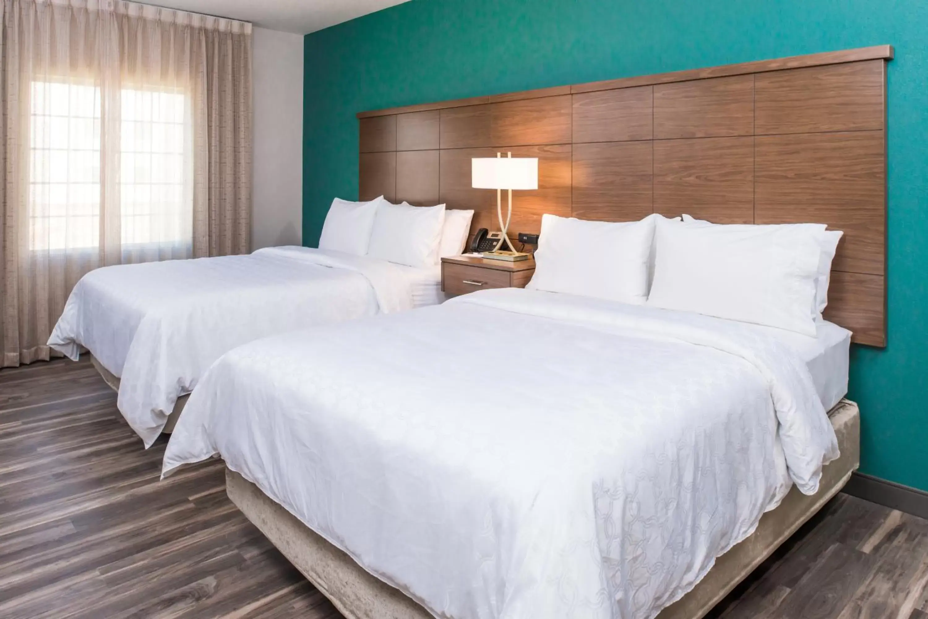 Bed in Staybridge Suites - Pecos, an IHG Hotel