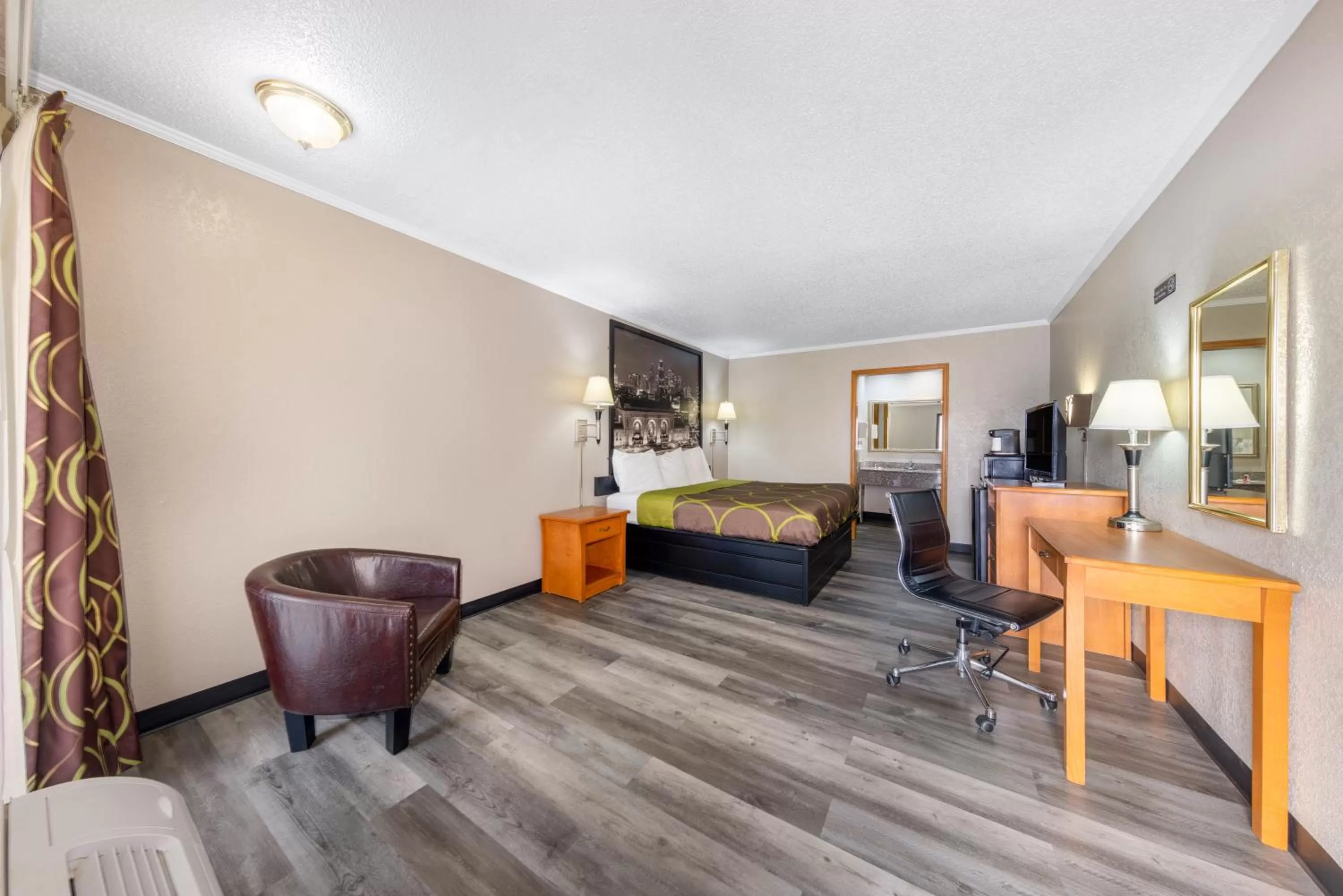 Bedroom in Super 8 by Wyndham Kansas City Airport North