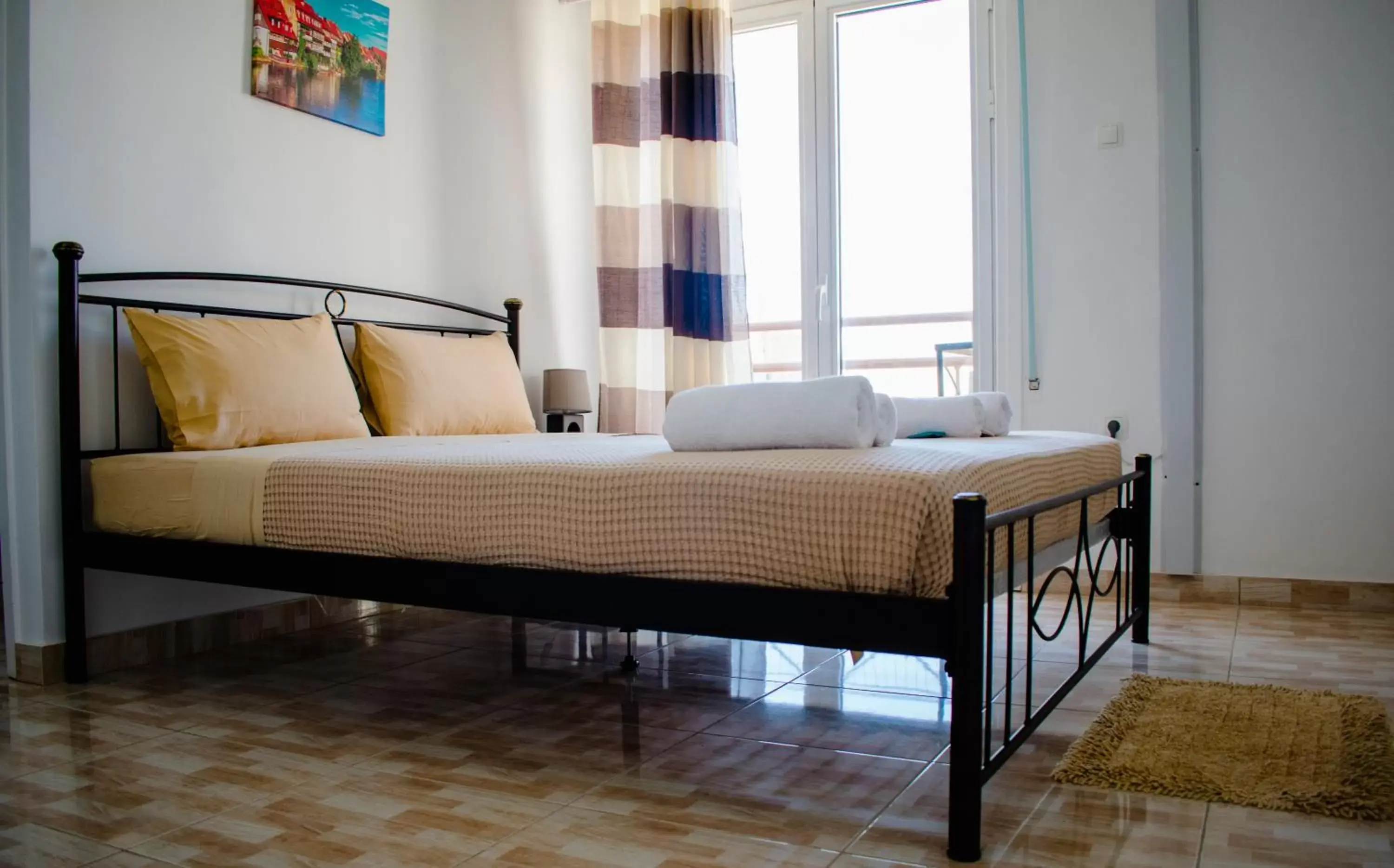 Bed in Nikolakakis Rooms Lavrio