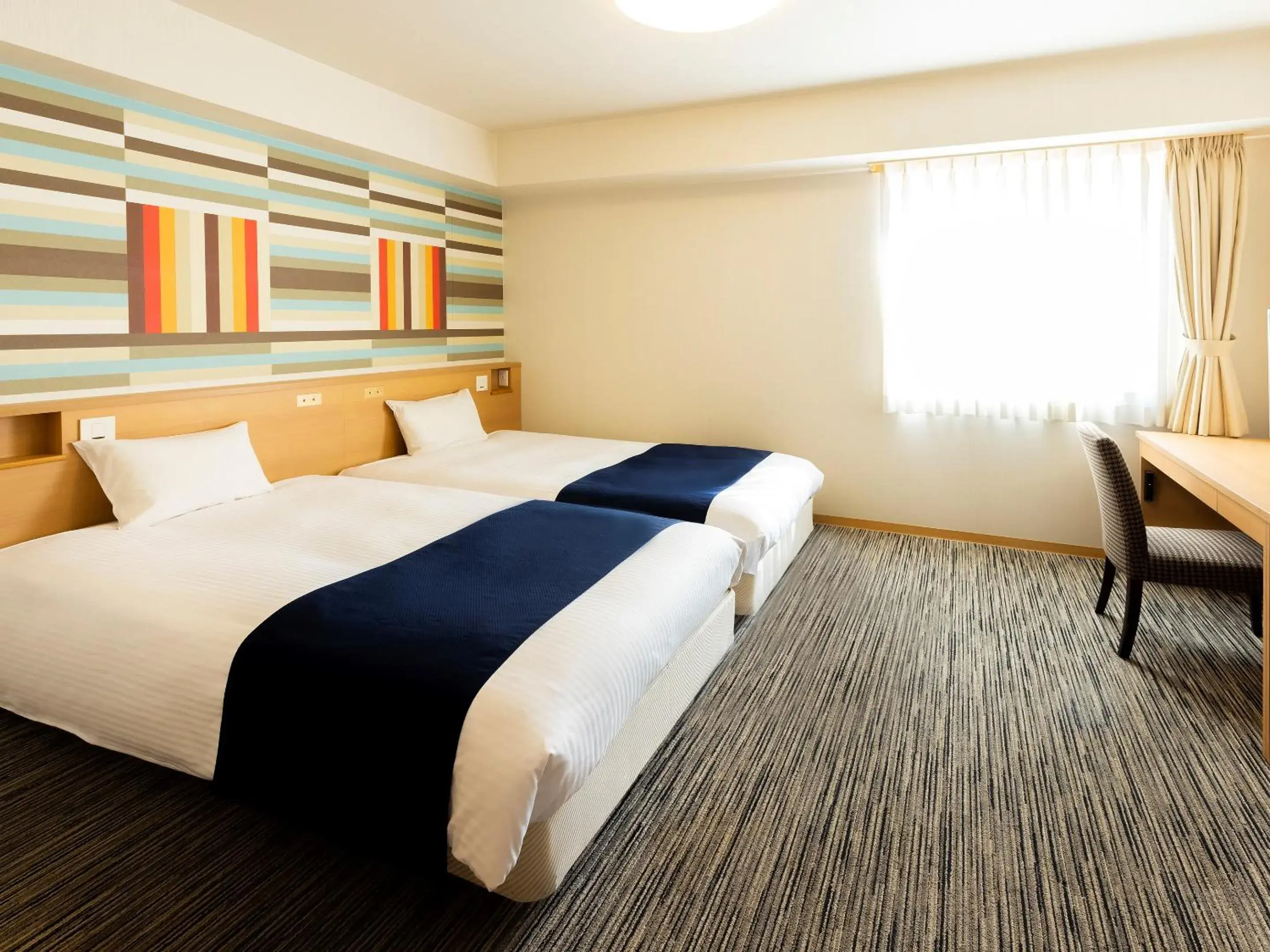 Bed in Hotel WBF Grande Asahikawa