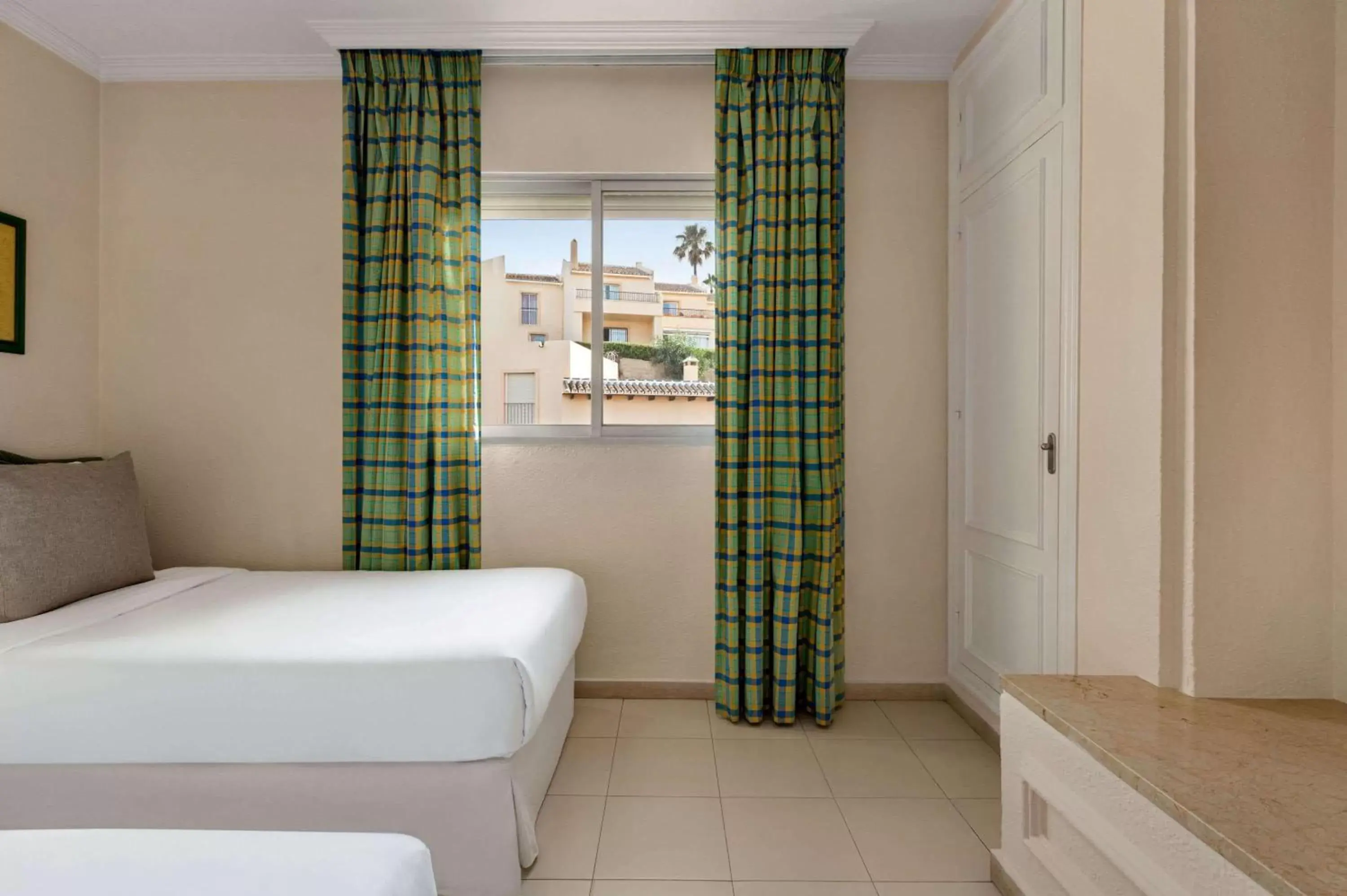 Photo of the whole room, Bed in Ramada Hotel & Suites by Wyndham Costa del Sol