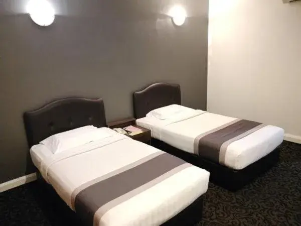Bed in Greenlast Hotel