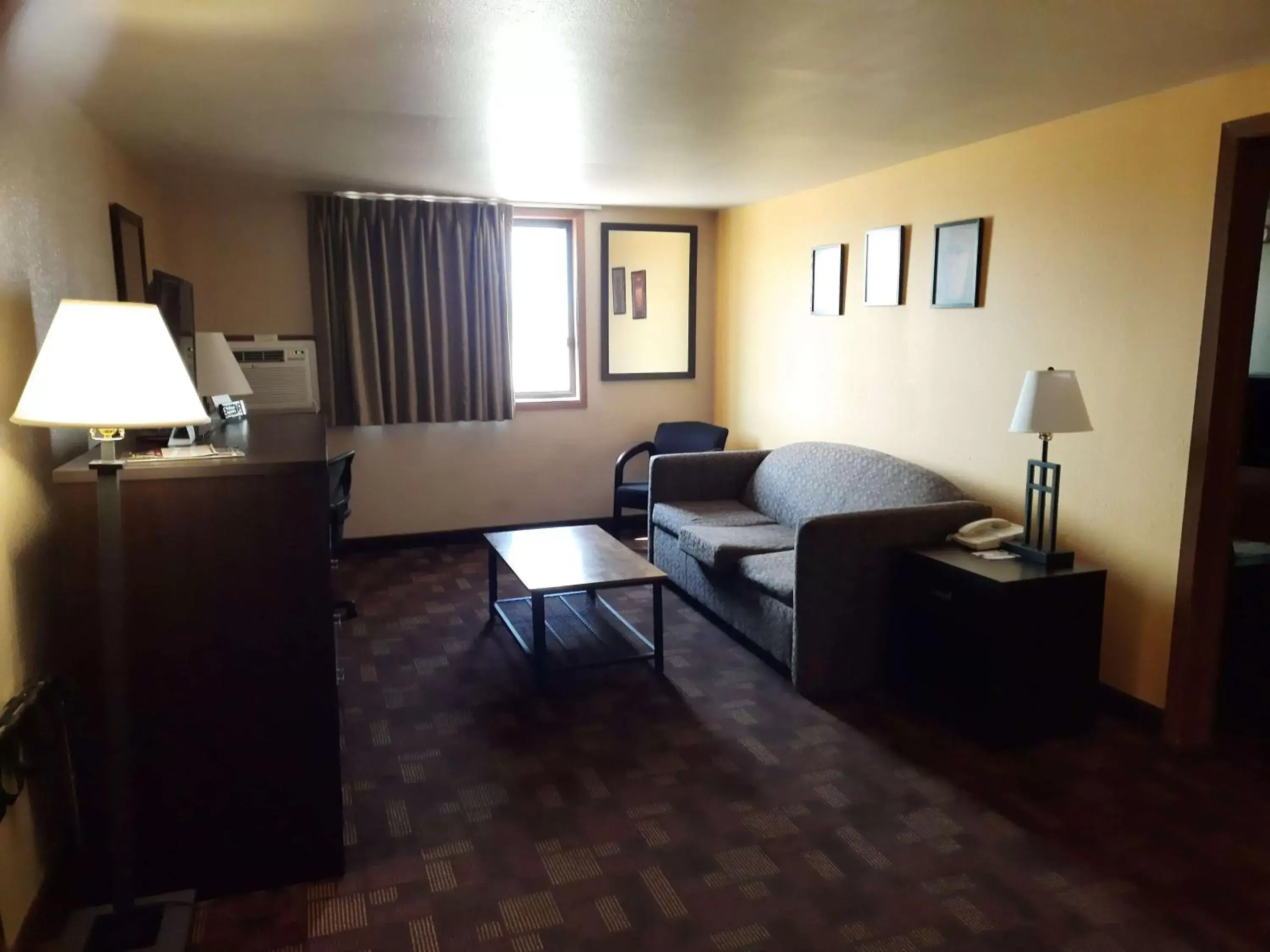 Photo of the whole room, Seating Area in Super 8 by Wyndham Watertown