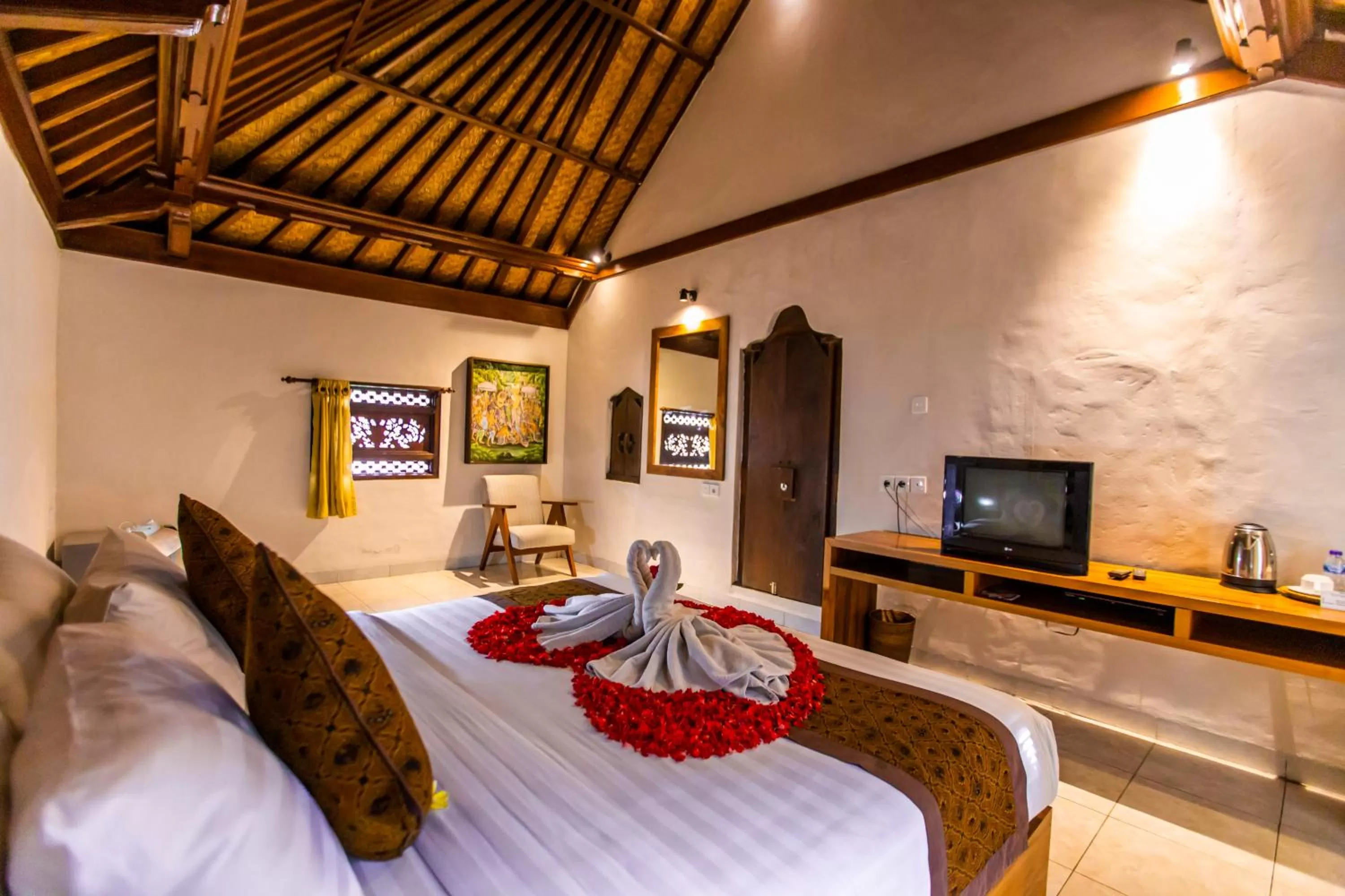 Bed in Seken Cottages Ubud
