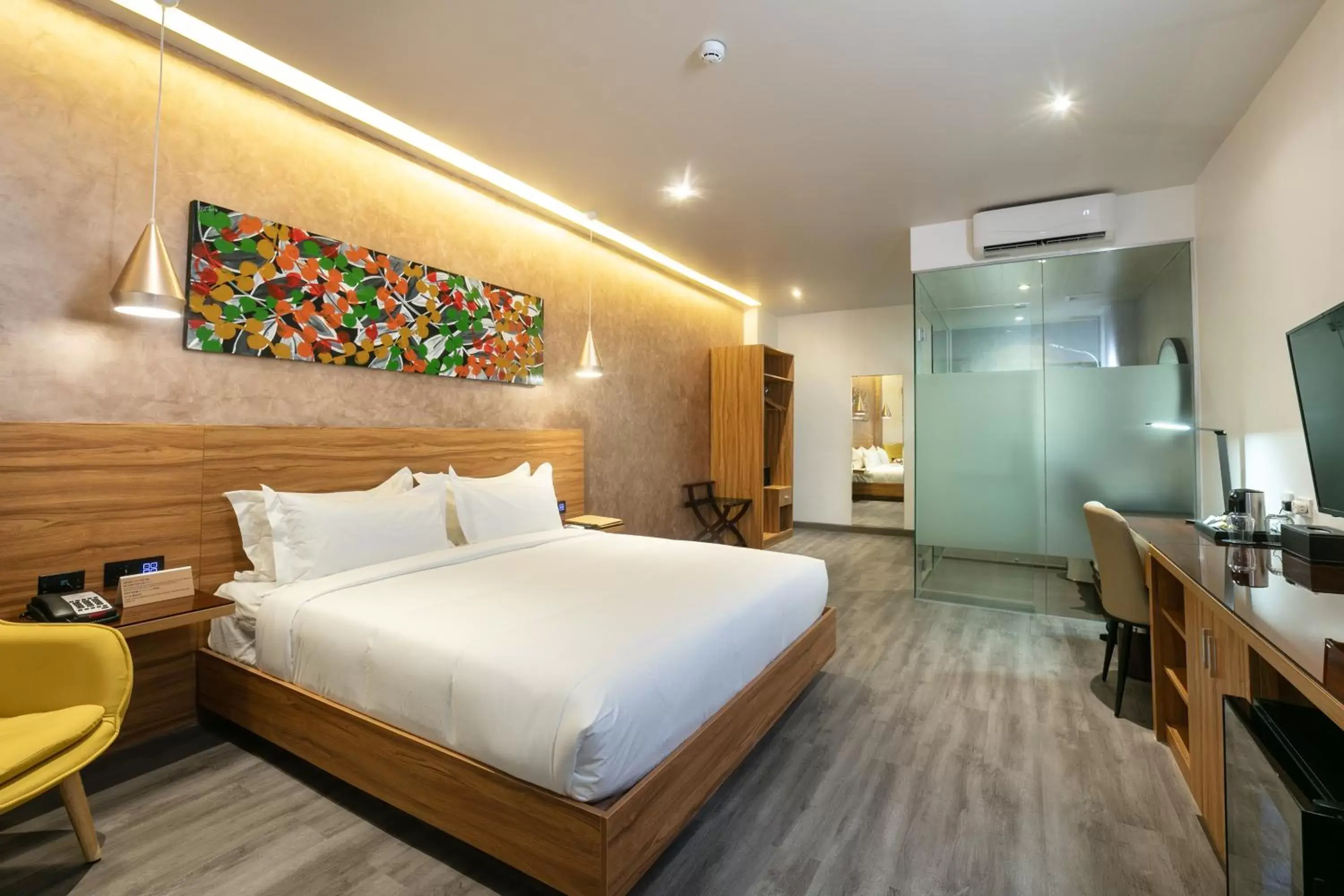 Bed in SureStay Plus Hotel by Best Western AC LUXE Angeles City