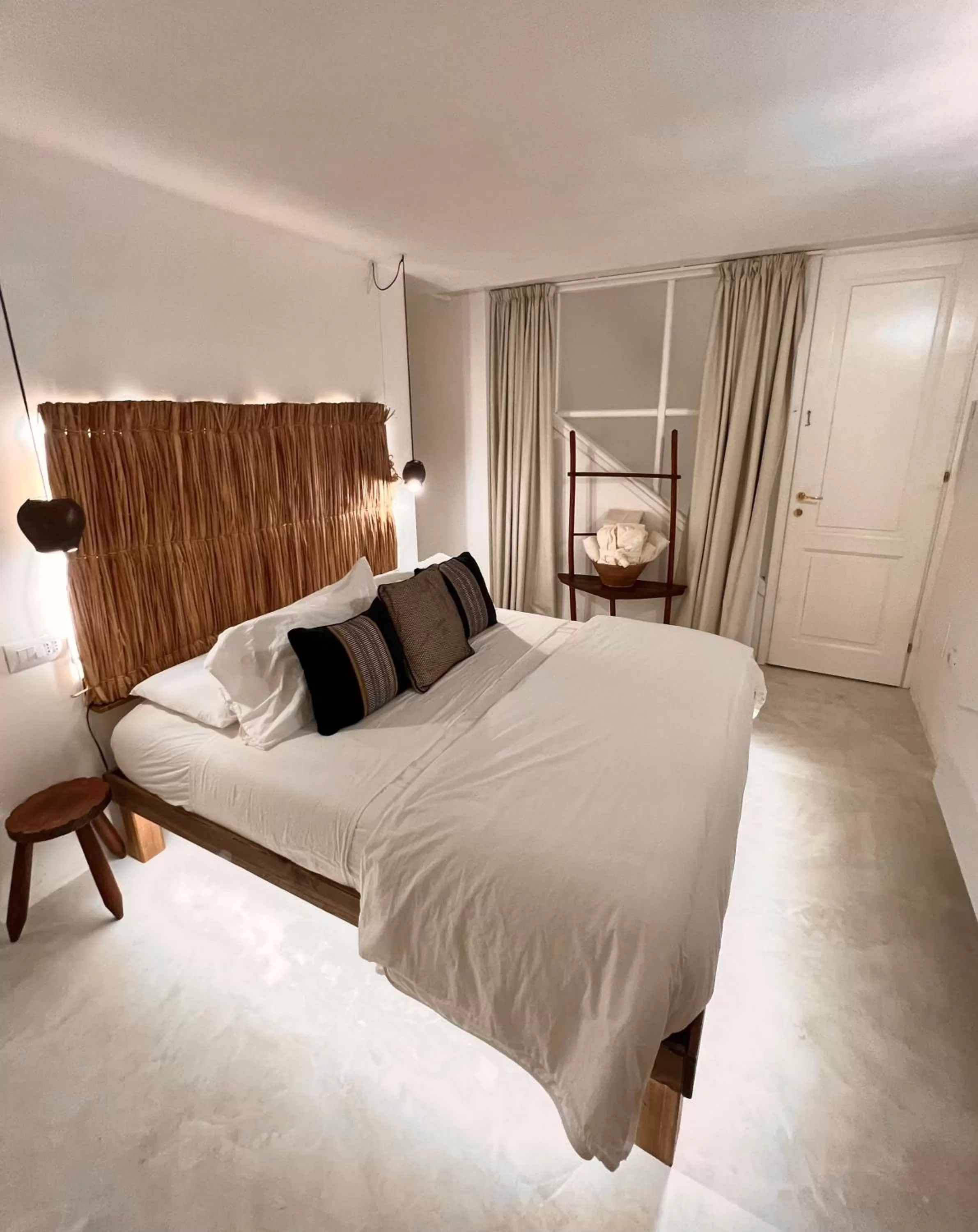 Bed in Crobi Museum and Suites