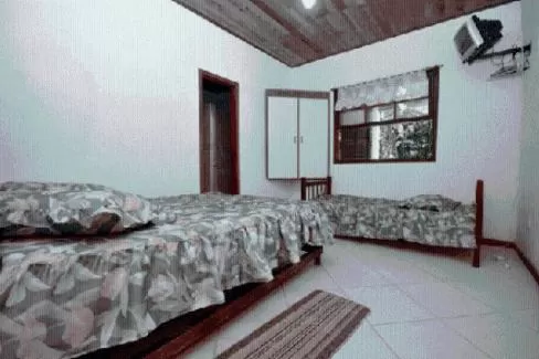 Bed in Pousada A Marca do Faraó