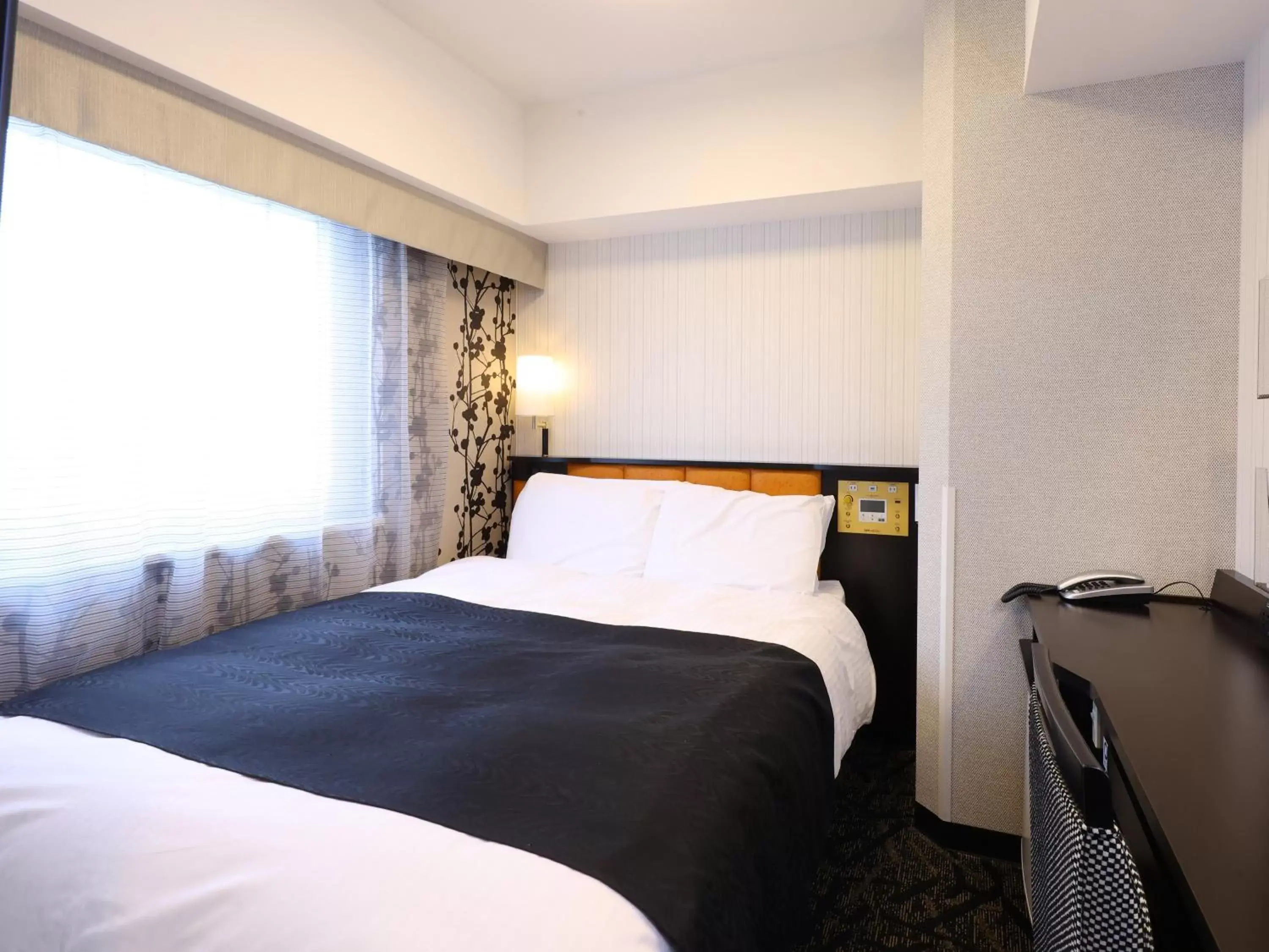 Photo of the whole room, Bed in APA Hotel Shizuoka-eki Kita