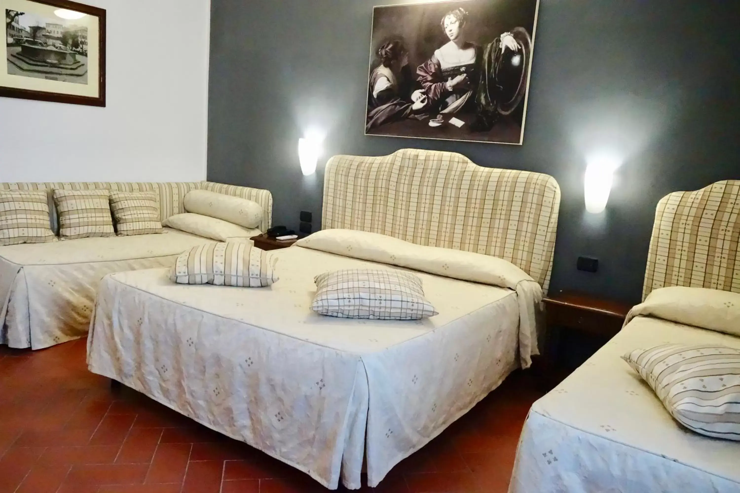 Bed, Seating Area in Hotel Caravaggio