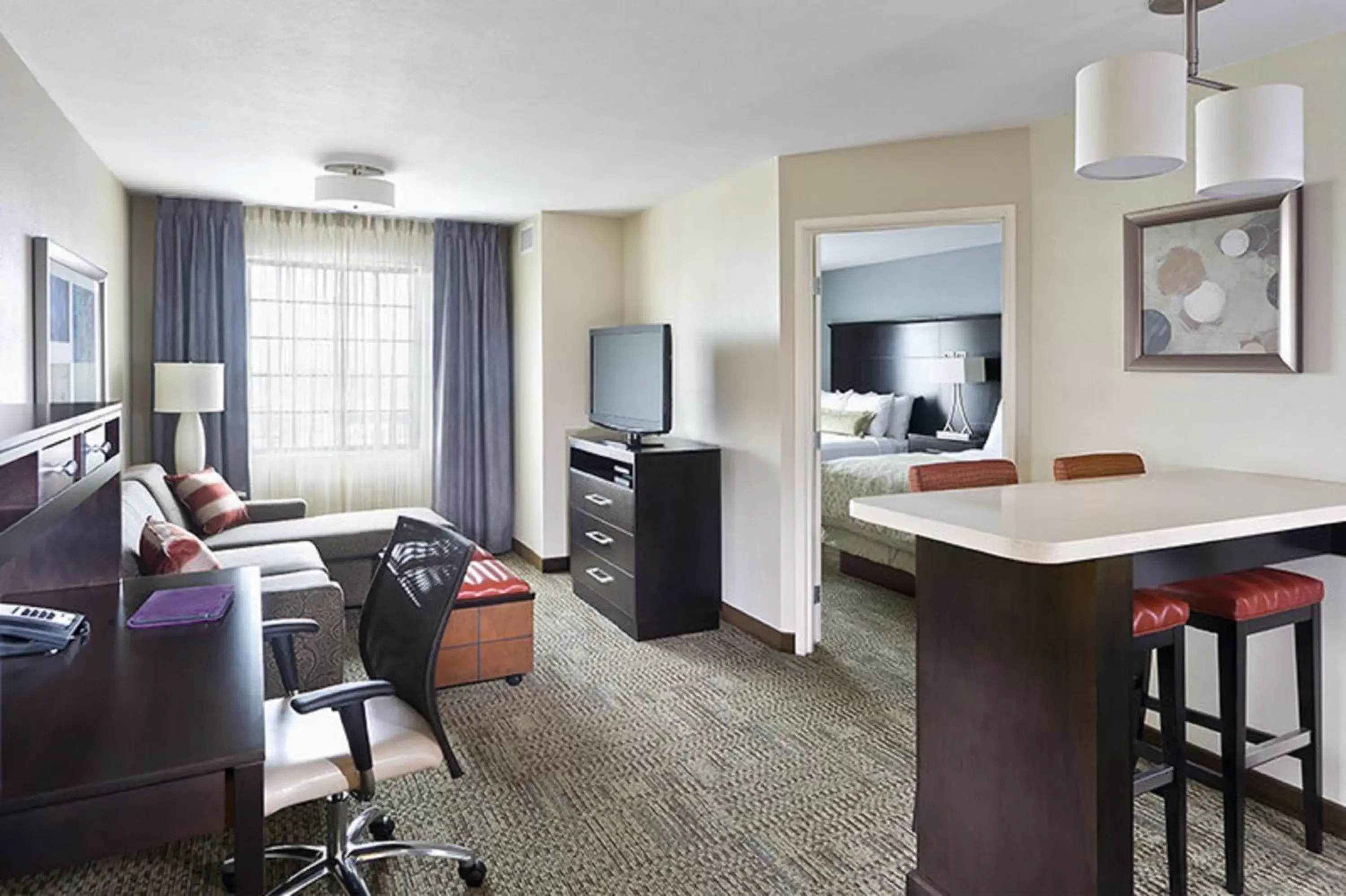 Photo of the whole room, Seating Area in Staybridge Suites Montgomeryville, an IHG Hotel
