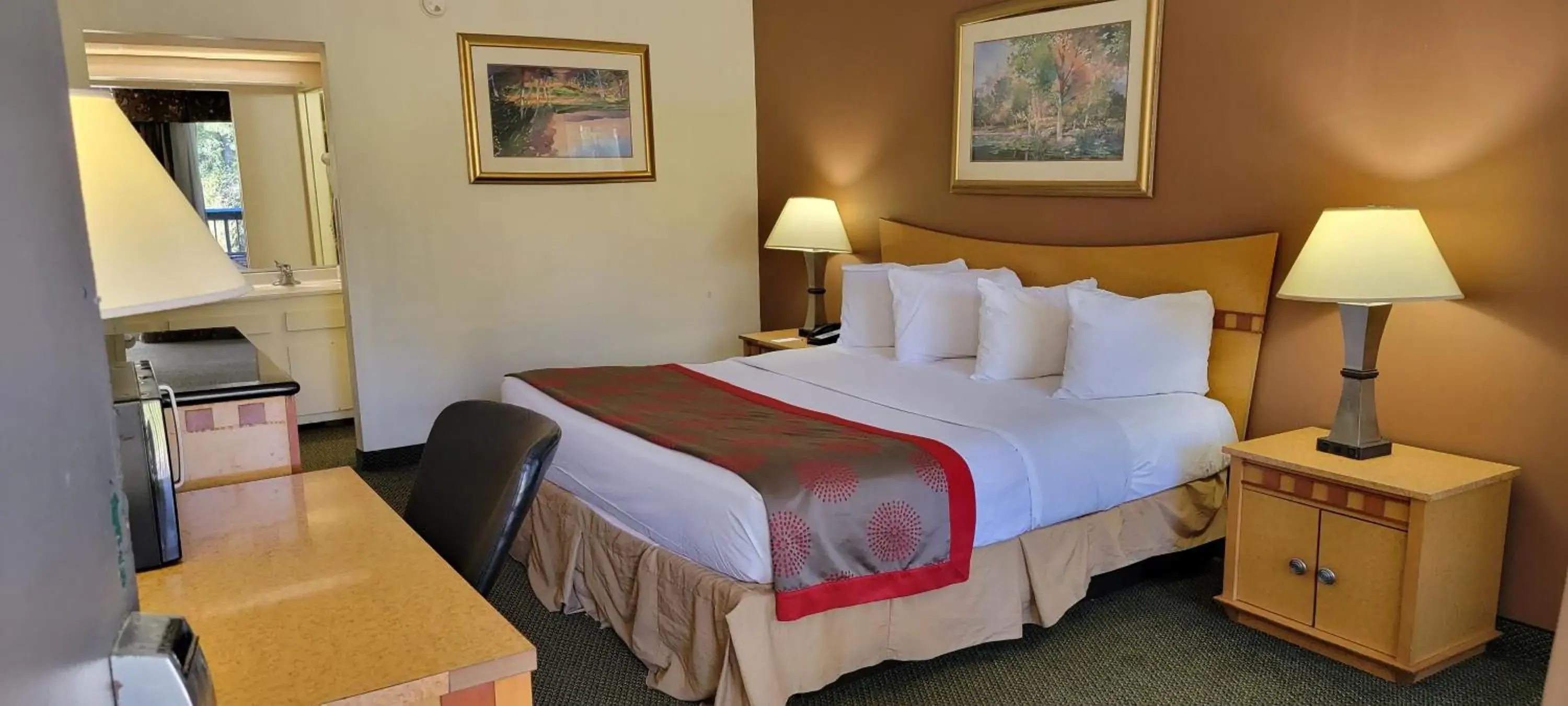 Bed in Ramada by Wyndham & Suites Warner Robins