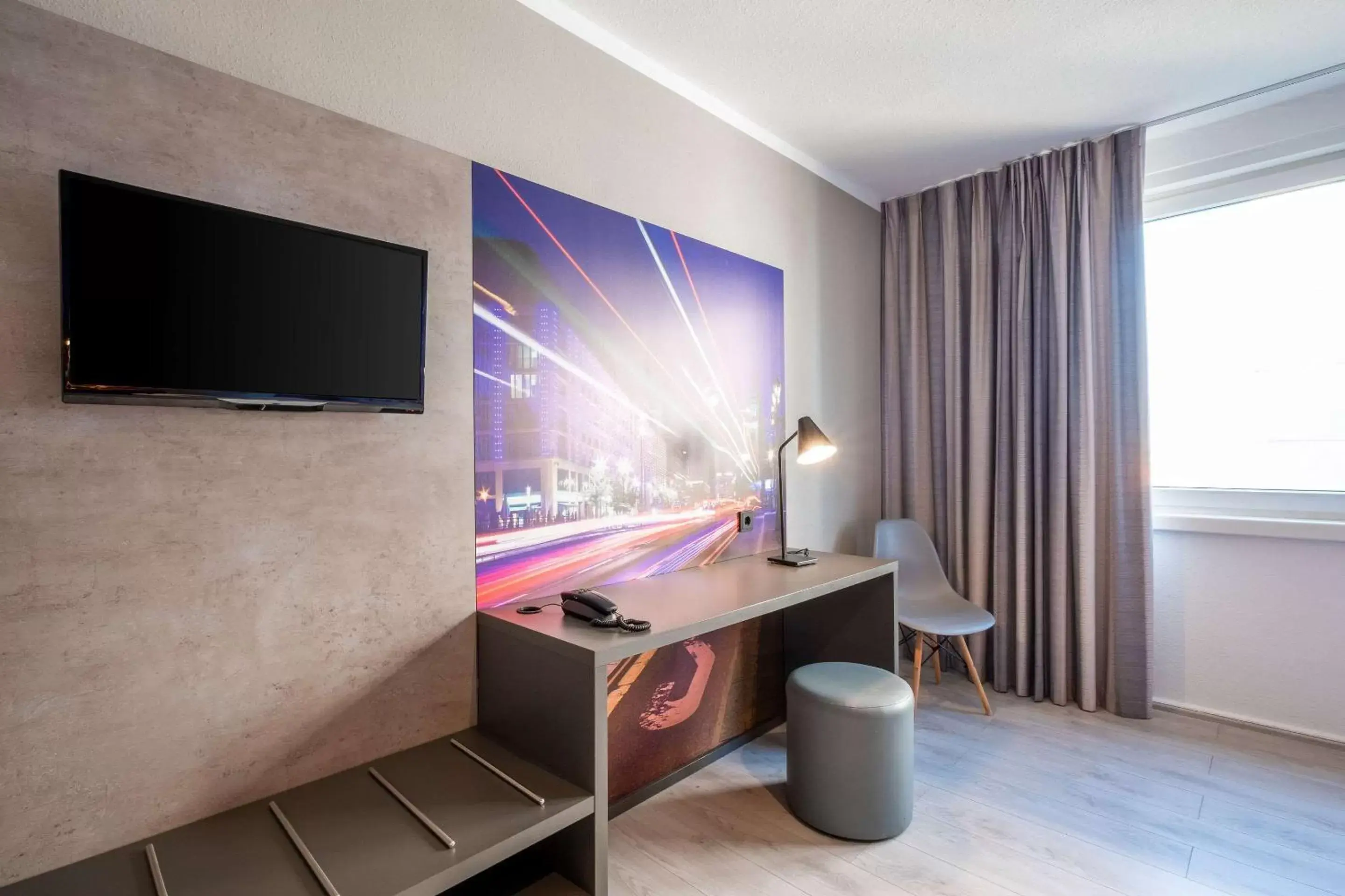 Photo of the whole room, TV/Entertainment Center in Comfort Hotel Lichtenberg