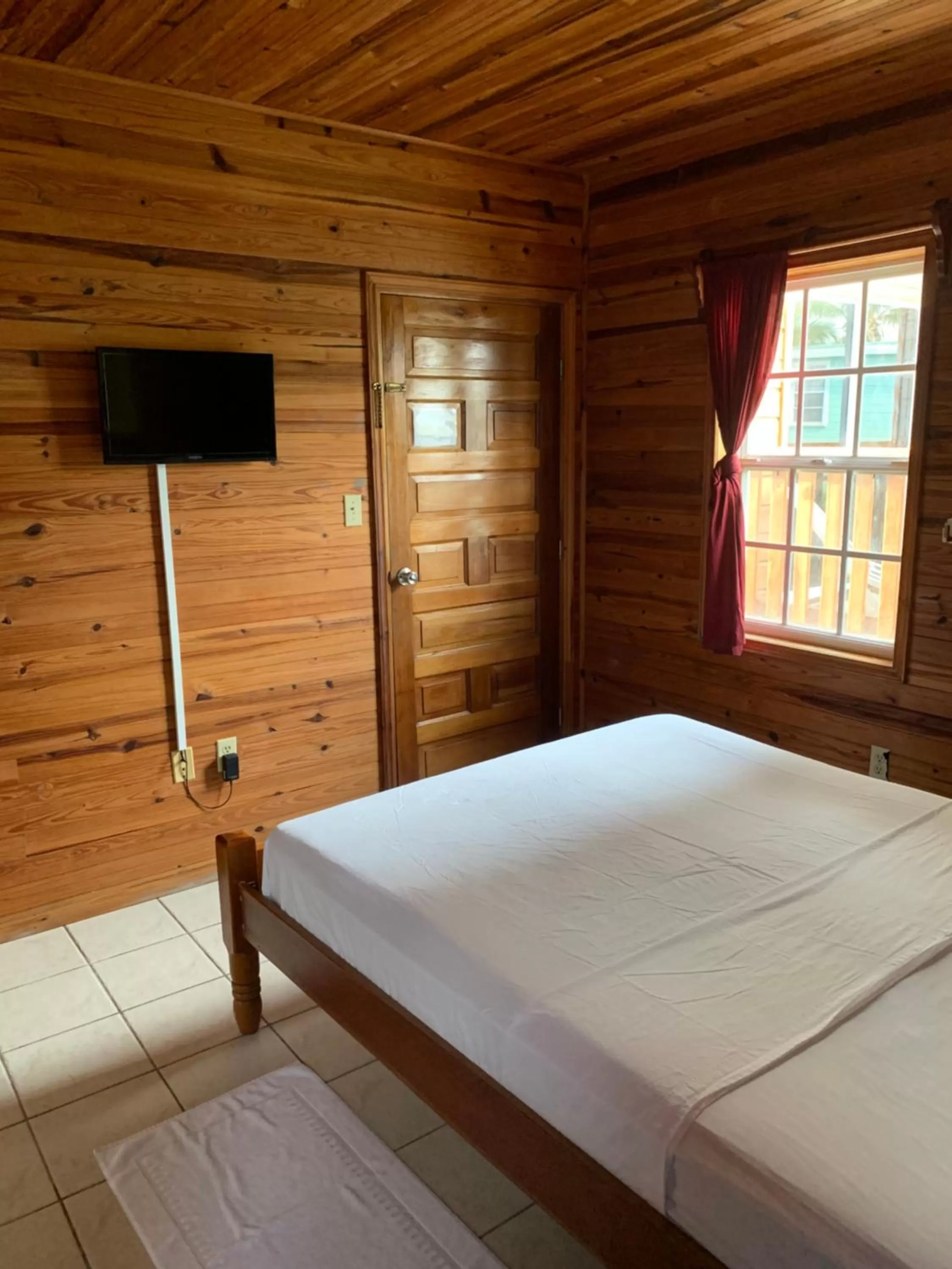 Bed in Blue Wave Guest House