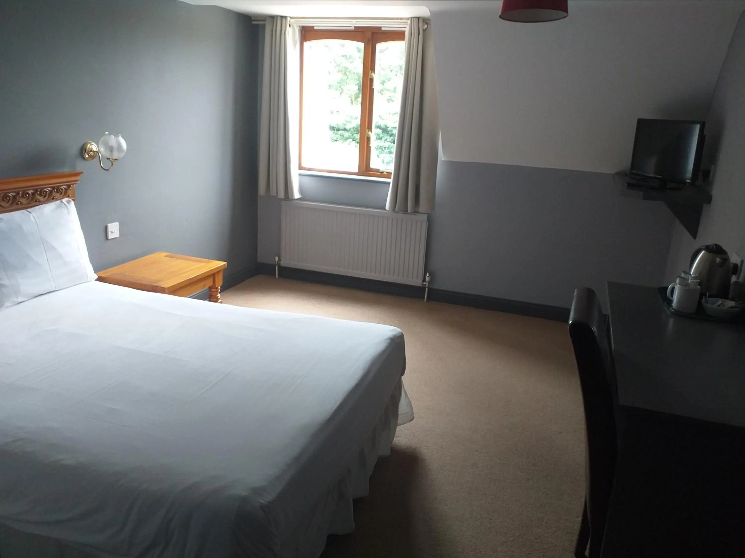 Bed in The Airman Hotel