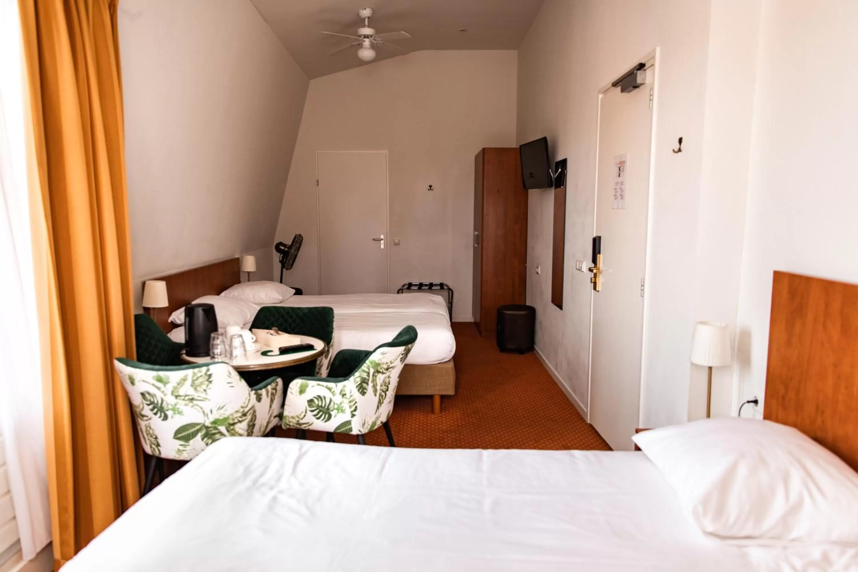 Bed in Ambassador City Centre Hotel