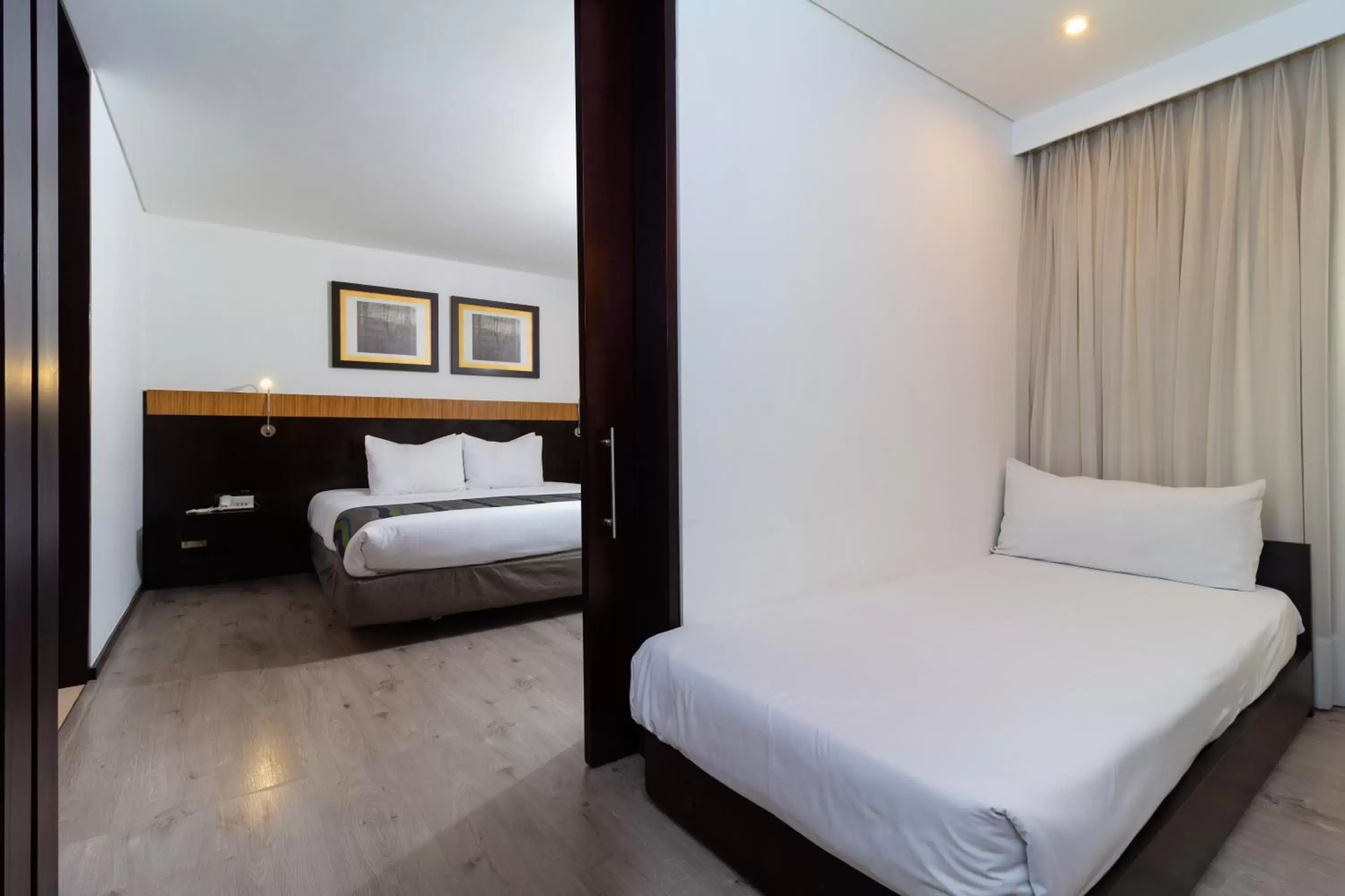 Bed in Hotel Madisson Inn Luxury By GEH Suites