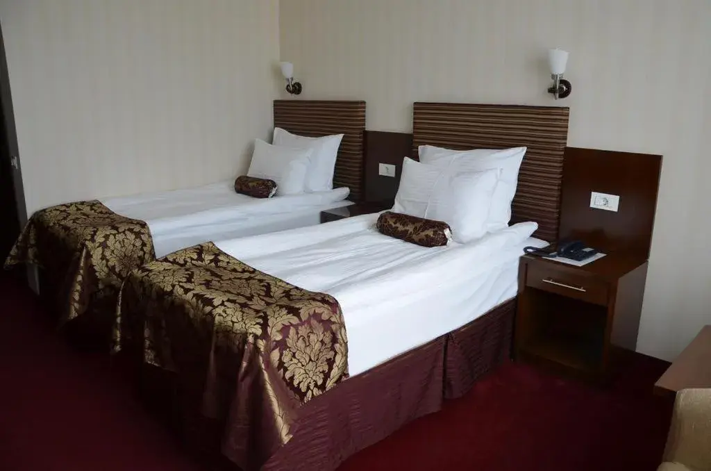 Bed in Grand Hotel Napoca
