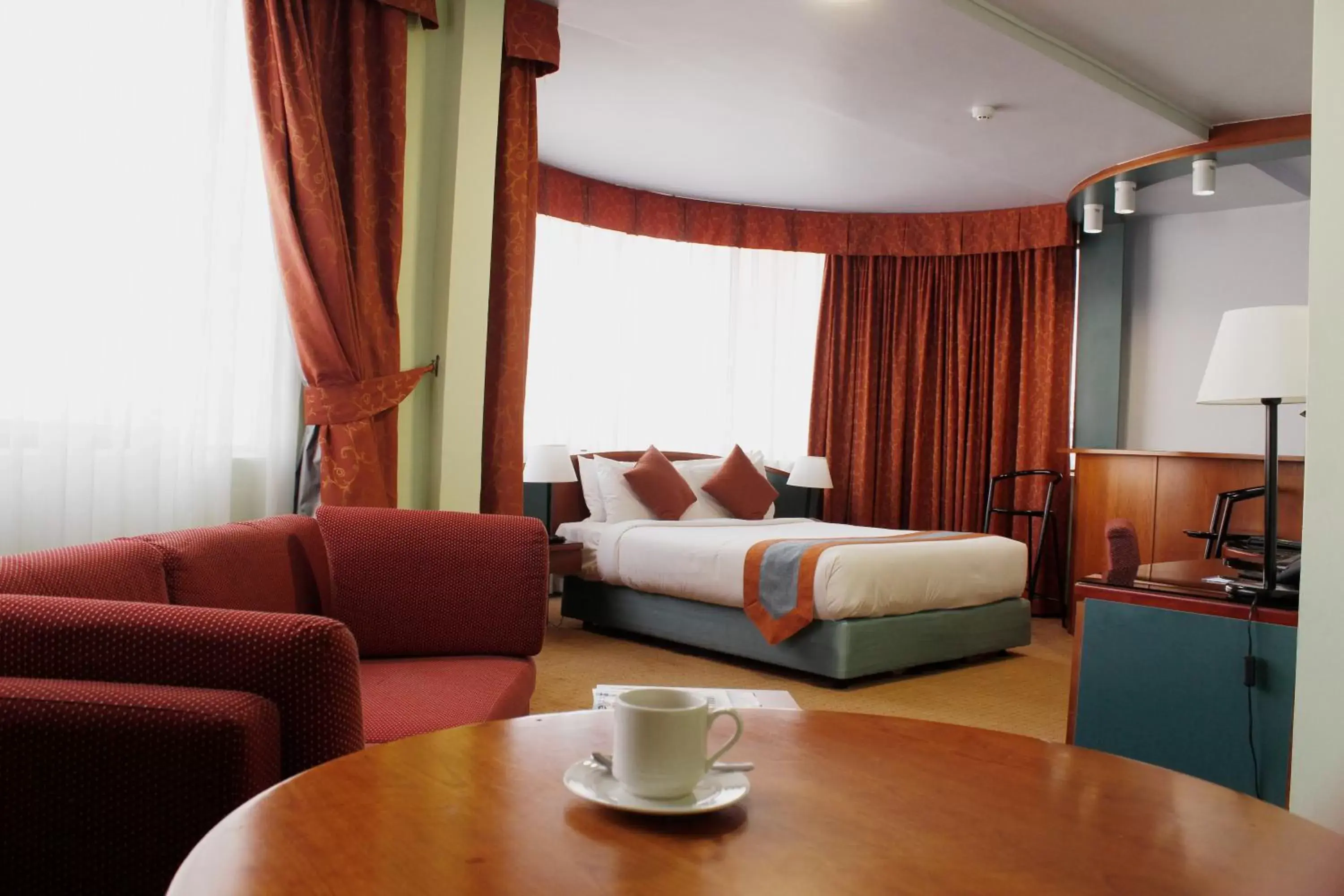 Bed, Seating Area in Al Diar Dana Hotel