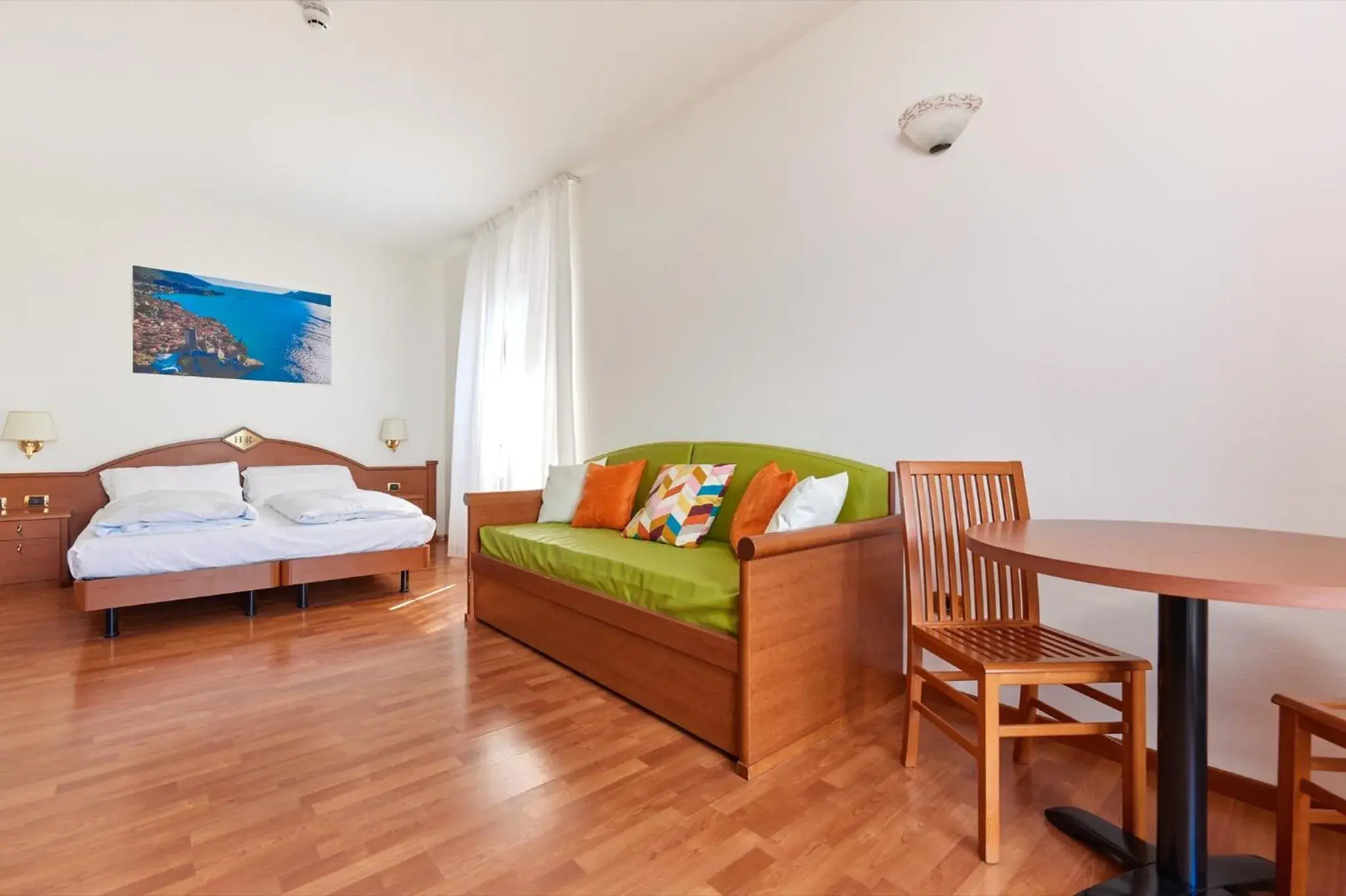 Seating area, Bed in Beach Hotel Rosa