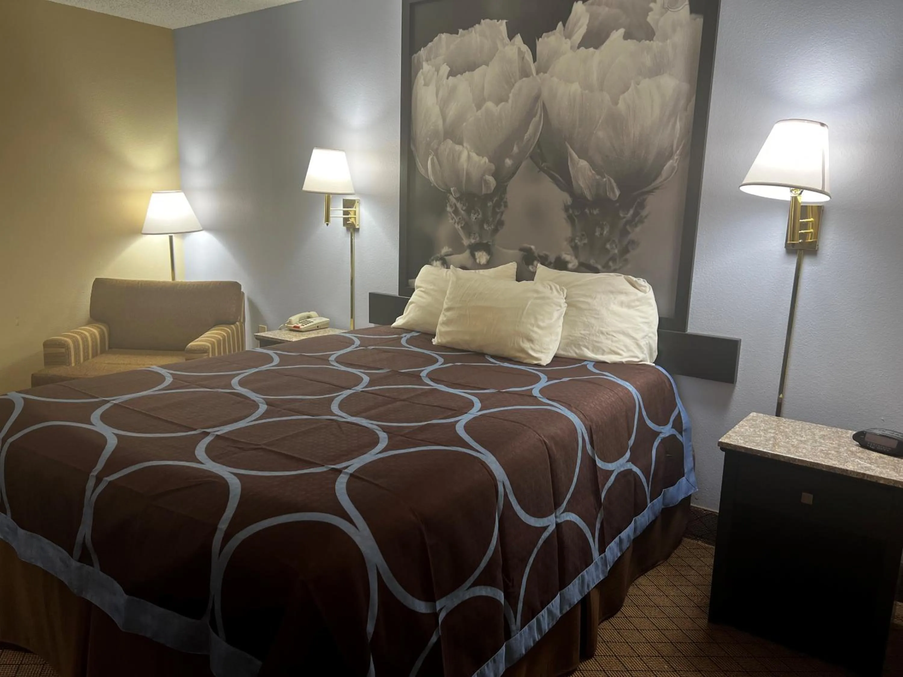 Bed in Super 8 by Wyndham Cleveland TX