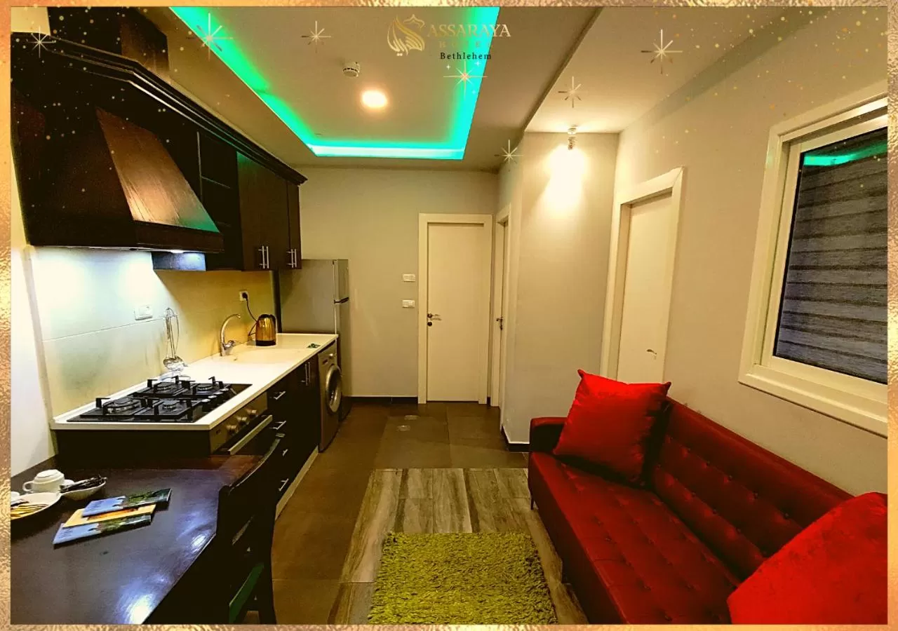 Kitchen or kitchenette in Assaraya Palace Hotel