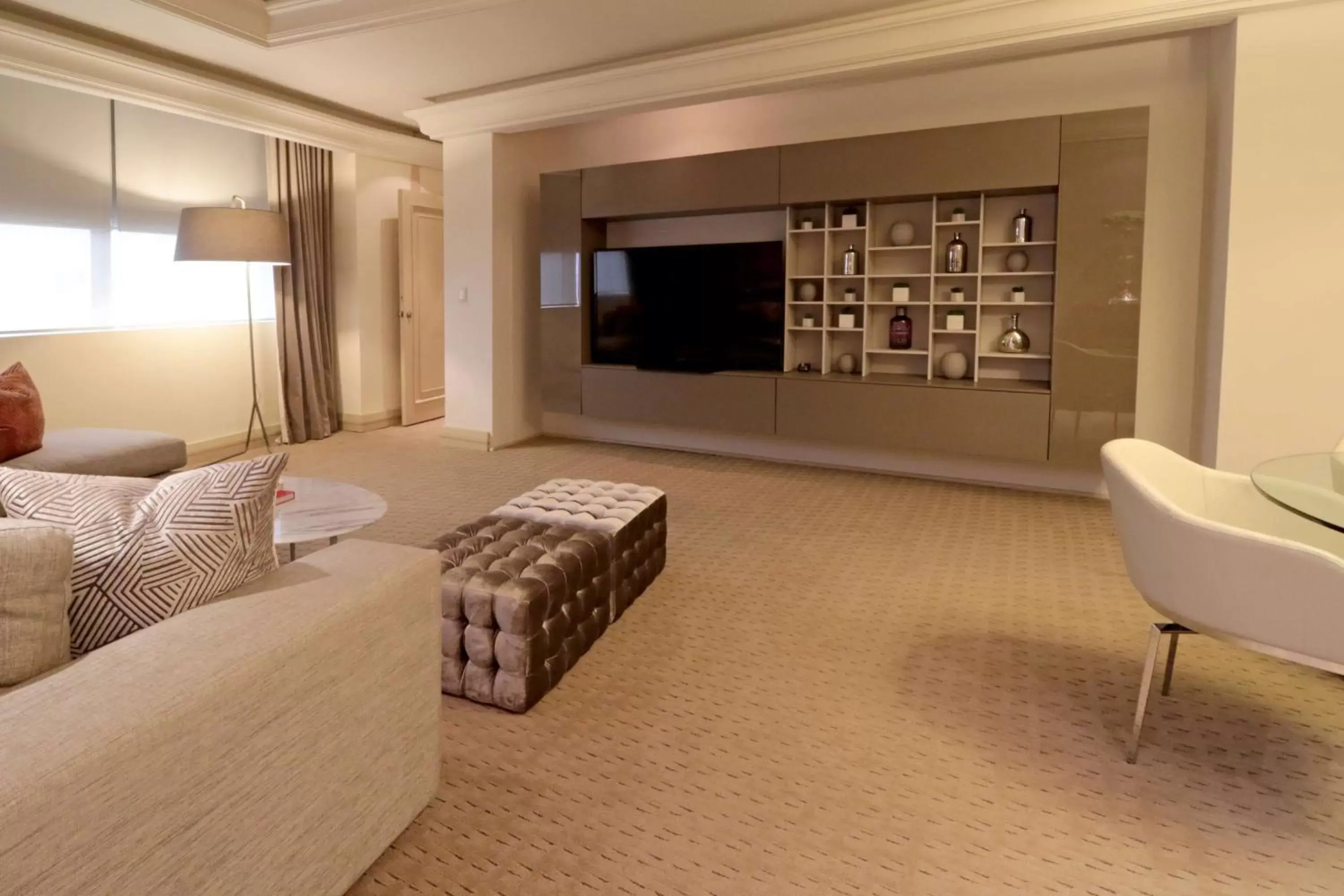 Living room, TV/Entertainment Center in MS Milenium Monterrey Curio Collection by Hilton