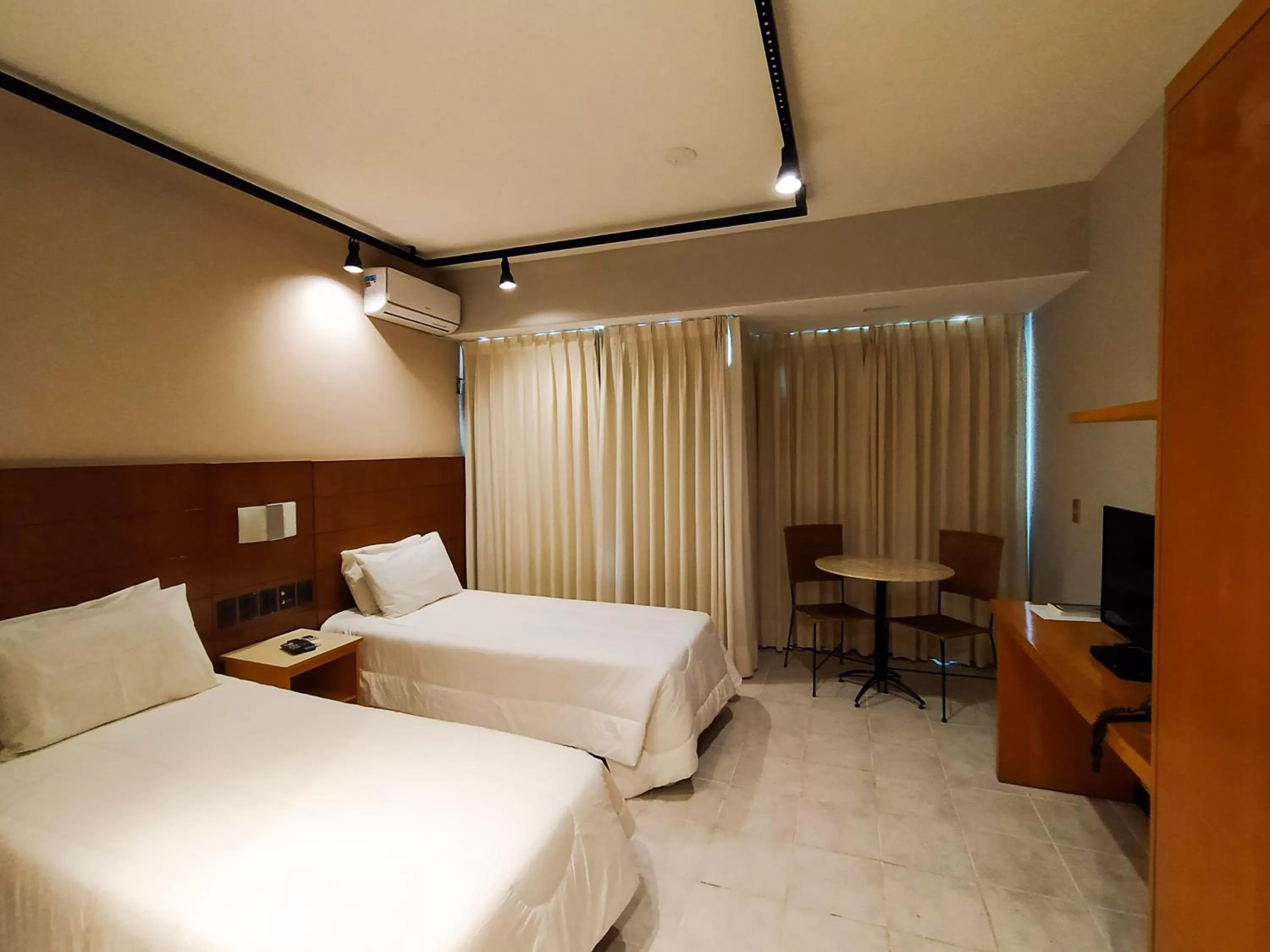 Photo of the whole room, Bed in Savassi Village