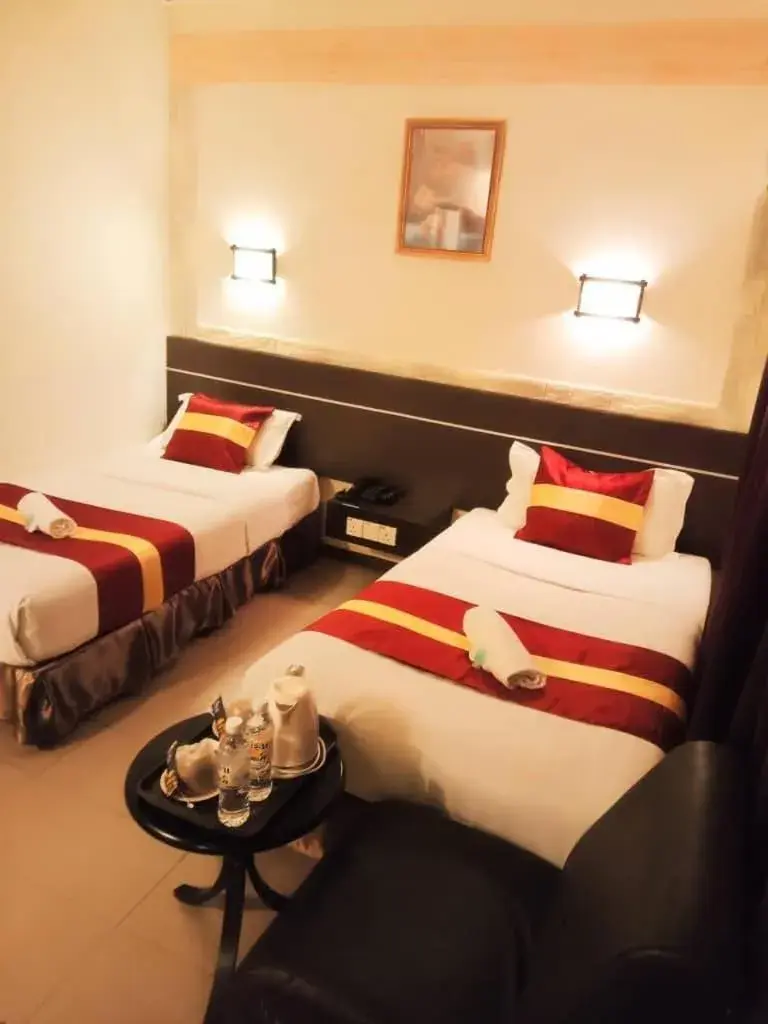 Bed in City Inn Hotel