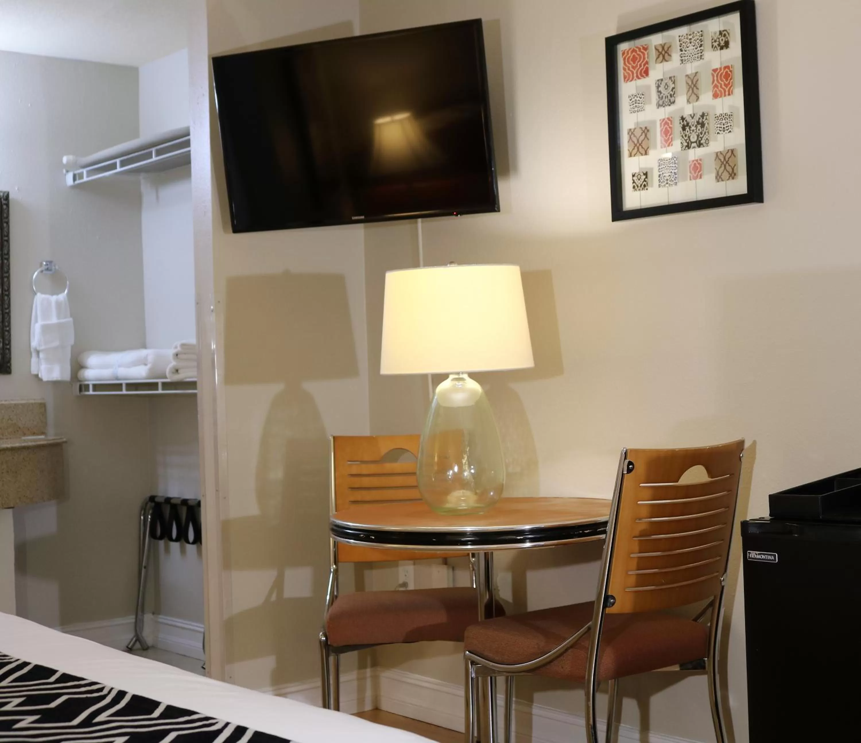 Photo of the whole room, TV/Entertainment Center in Monte Carlo Inn- Near Disney