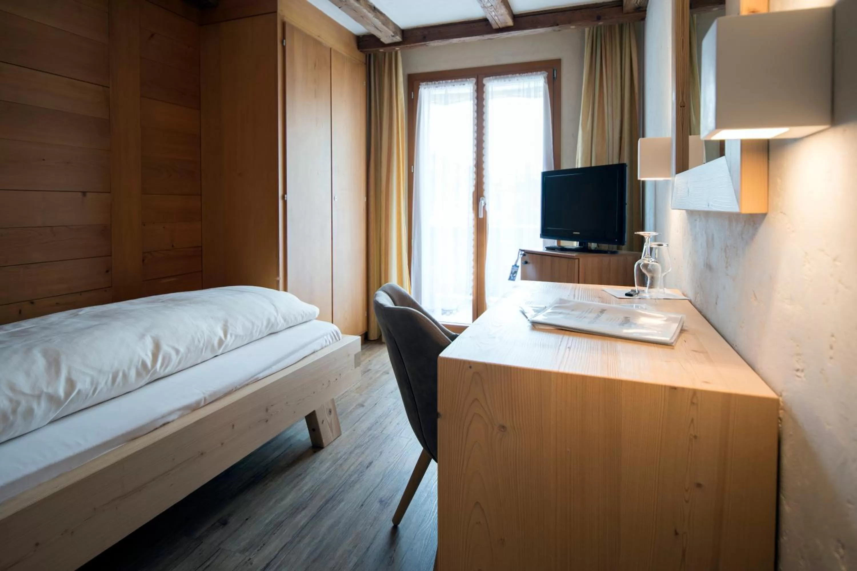 Bed in Hotel Alphorn