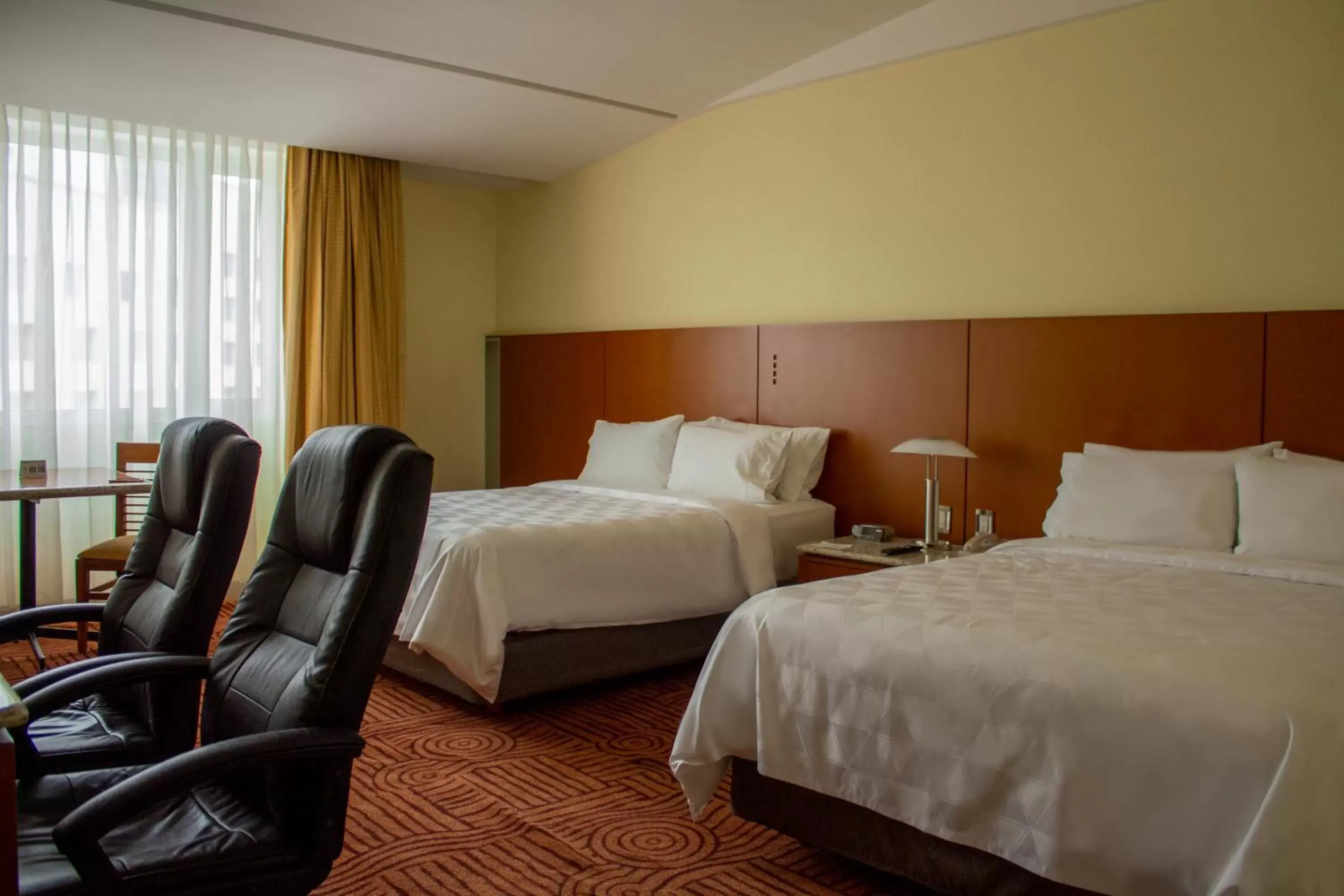 Bed in Holiday Inn Puebla Finsa, an IHG Hotel