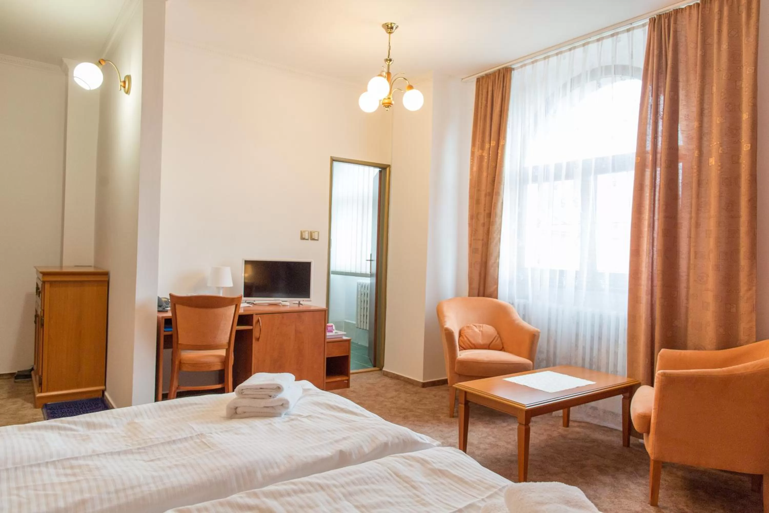 Seating area, Bed in Hotel Grand
