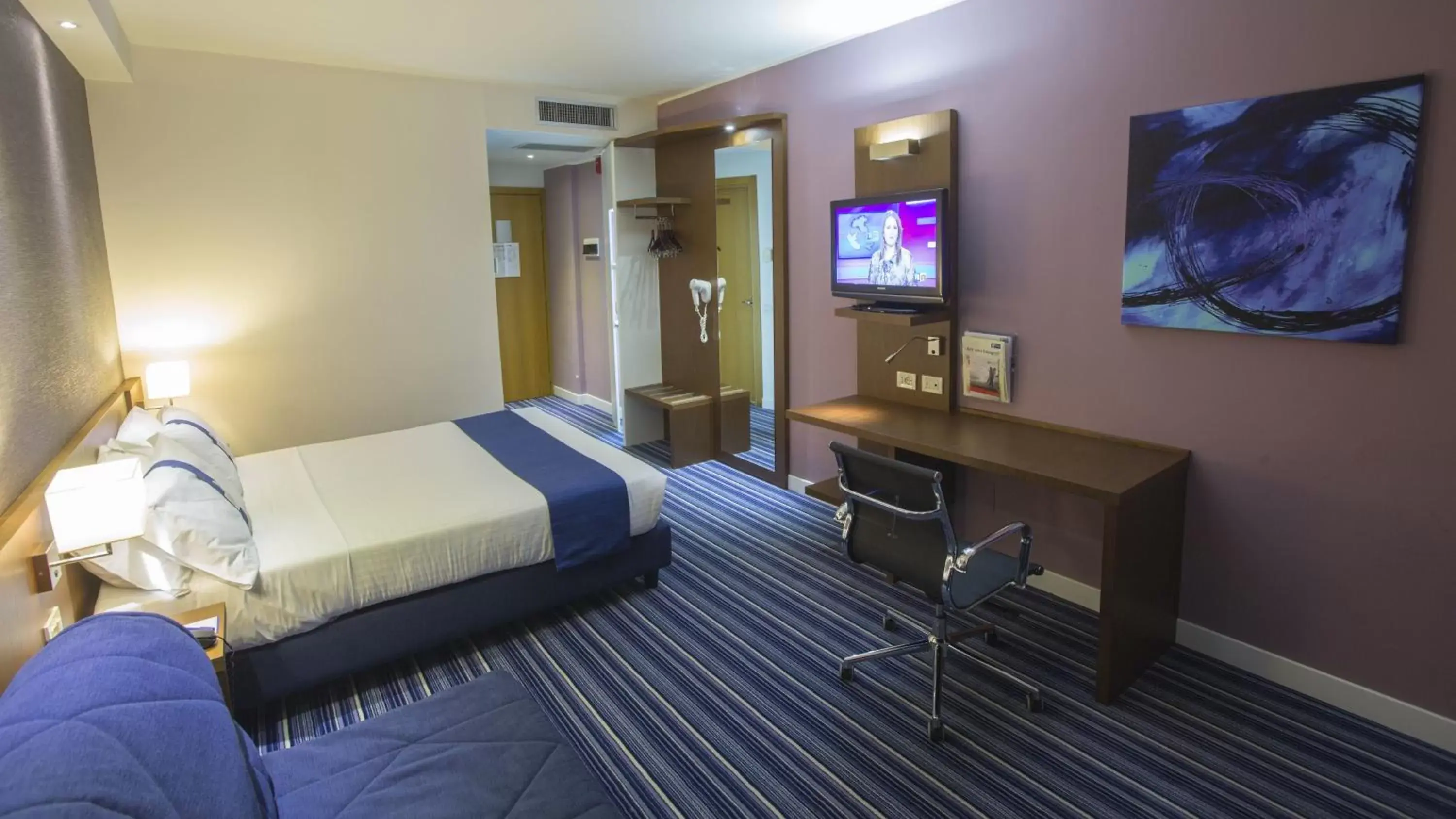 Bedroom, TV/Entertainment Center in GP Hotel