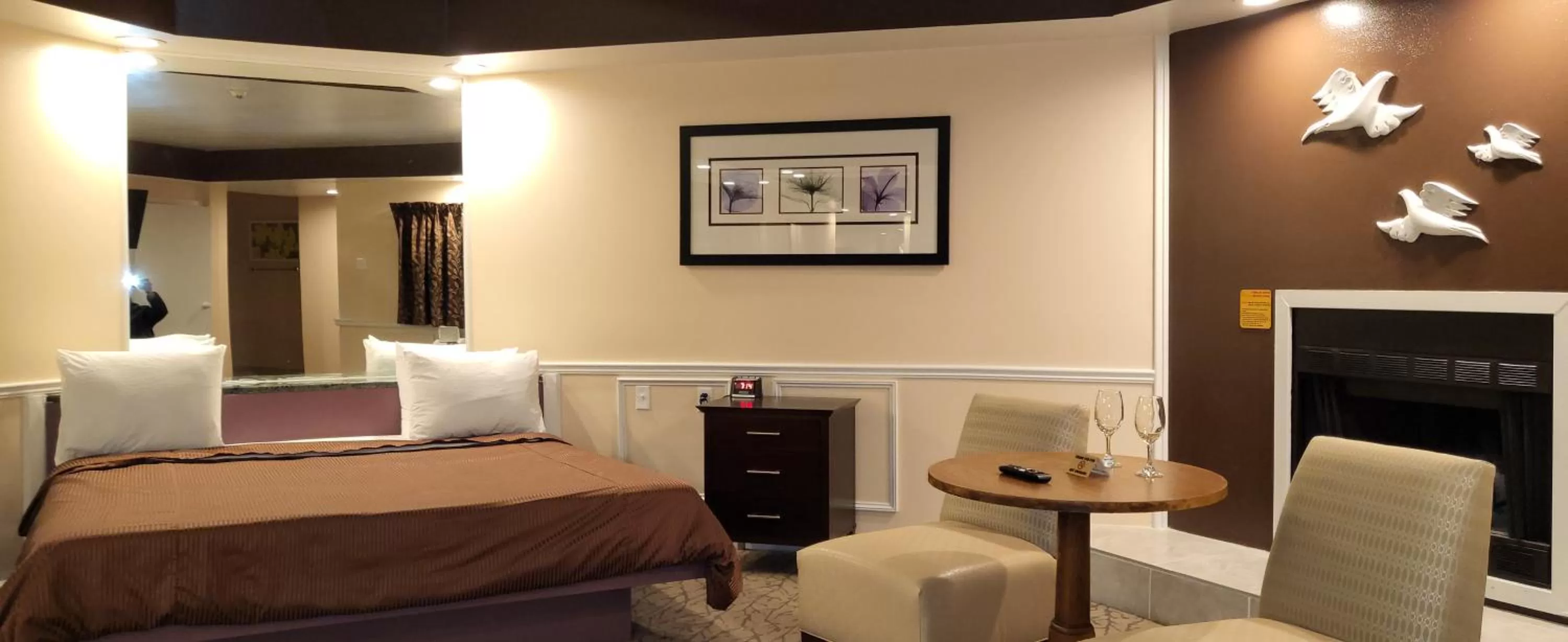 Seating area, Bed in Inn of the Dove - Romantic Luxury Suites with Jacuzzi & Seasonal Fireplace at Harrisburg-Hershey-Philadelphia, PA
