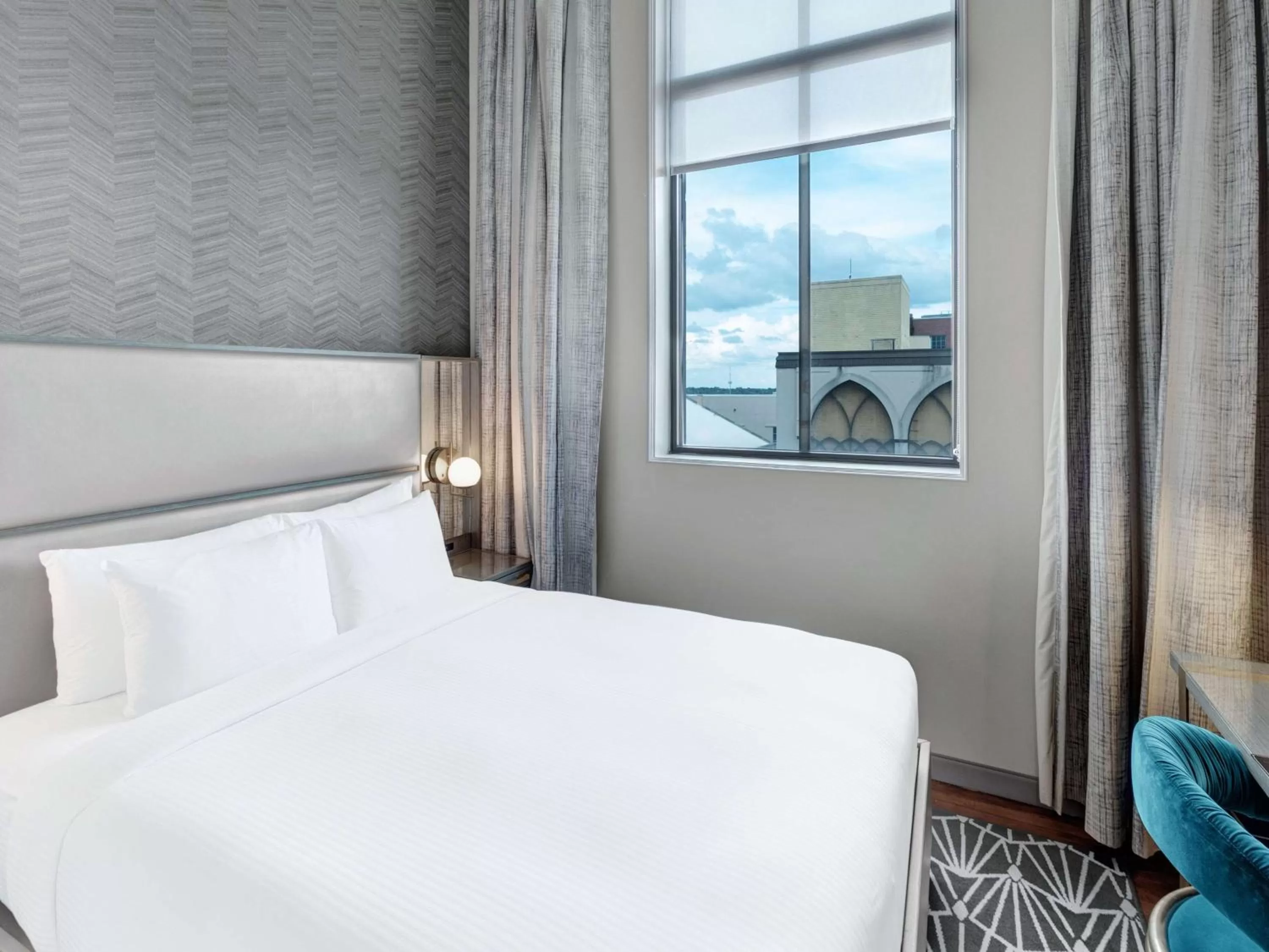 Bed in Tulsa Club Hotel Curio Collection By Hilton