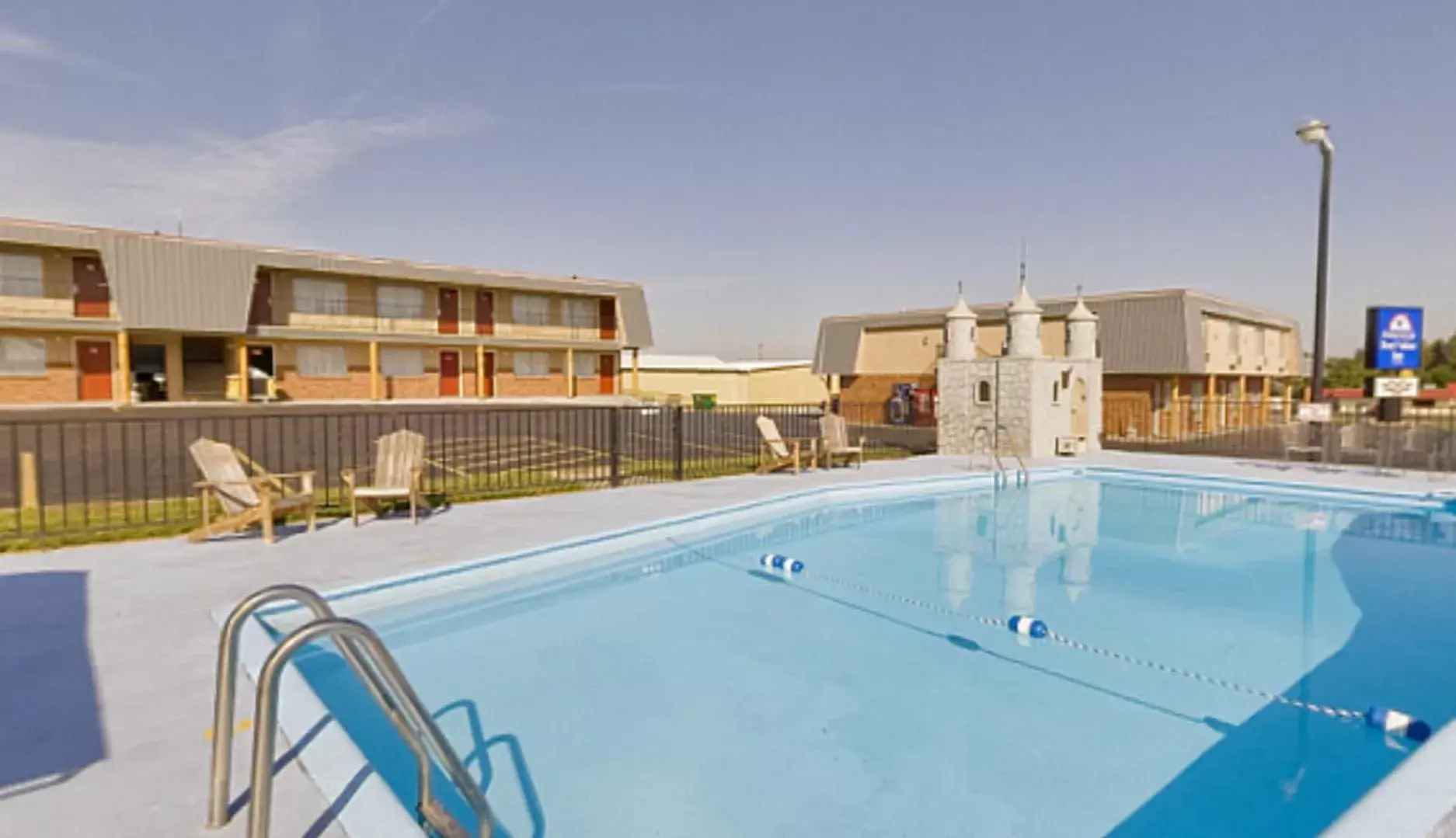 Swimming pool in Americas Best Value Inn Wall Swimming pool in Americas Best Value Inn Wall